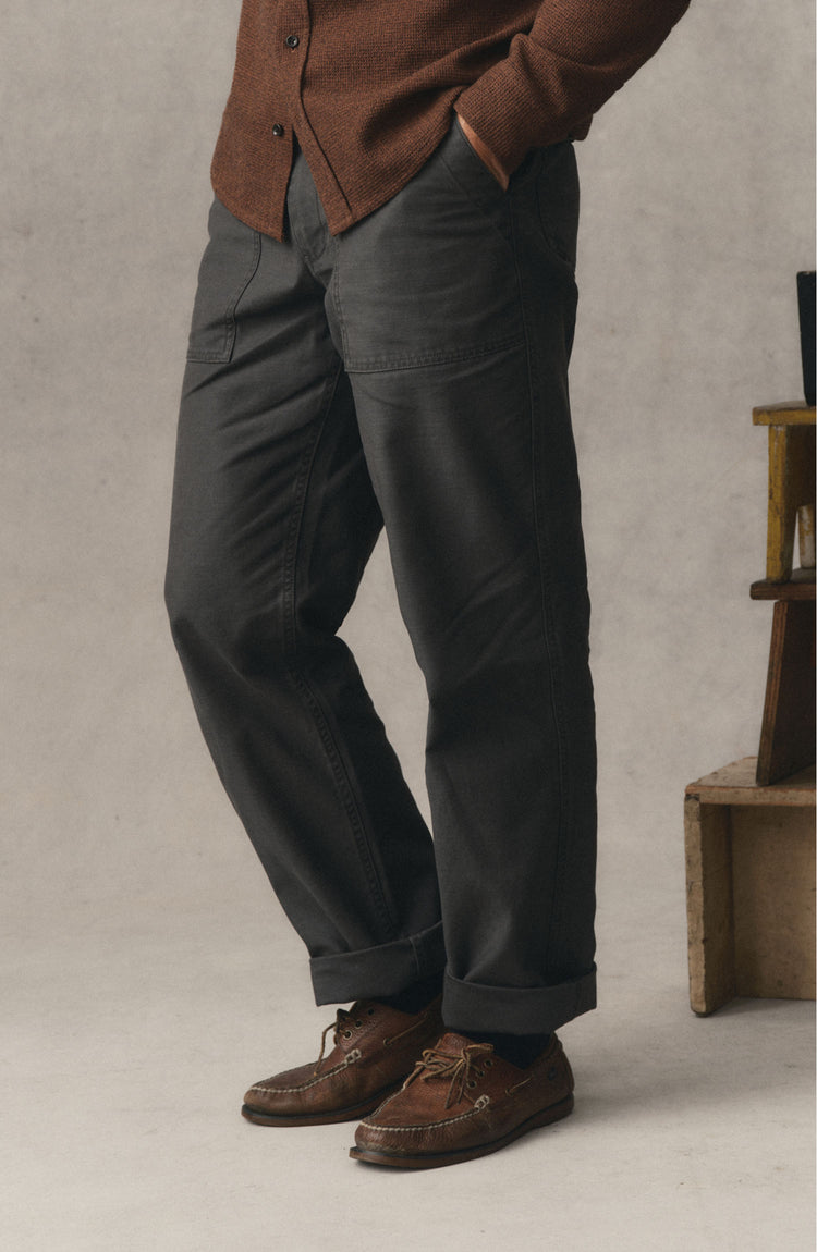 fit model posing in The Surplus Pant in Faded Black Reverse Sateen