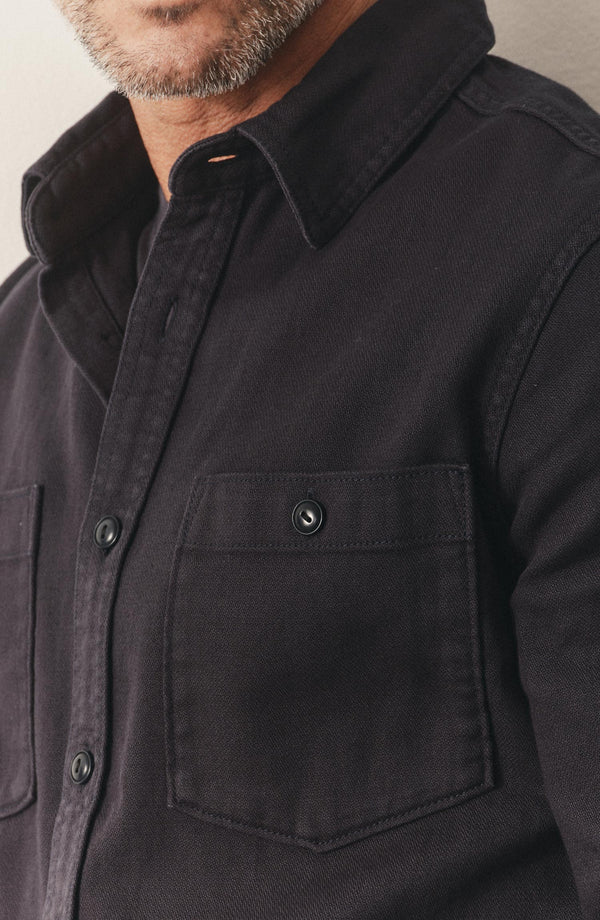 fit model showing off the pocket on The Dispatch Shirt in Navy Broken Twill