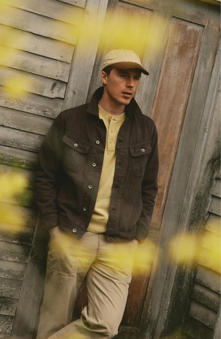 fit model posing in The Long Haul Jacket in Soil Slub Denim