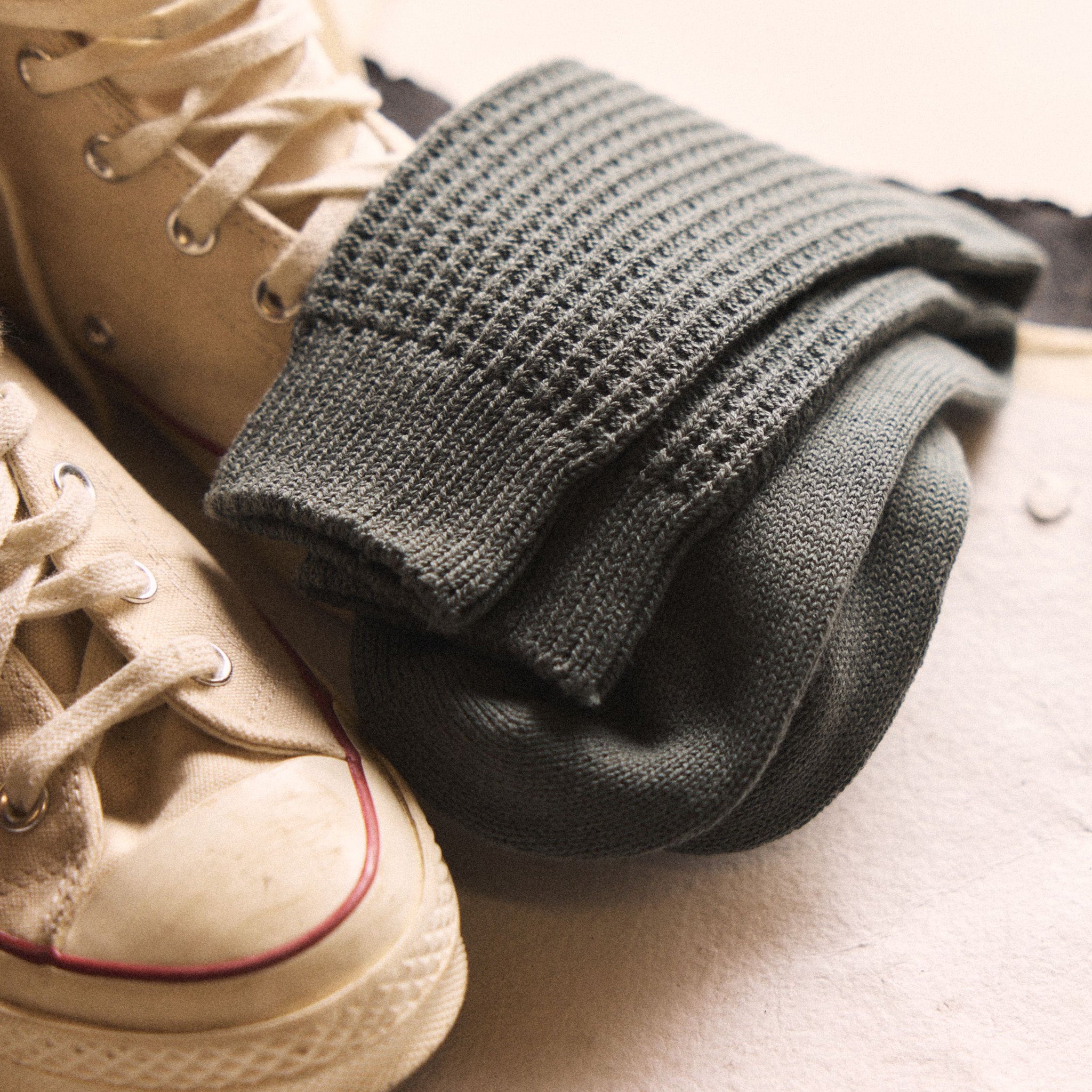 The Waffle Sock in Deep Sea on a shoe, Accessories by Taylor Stitch