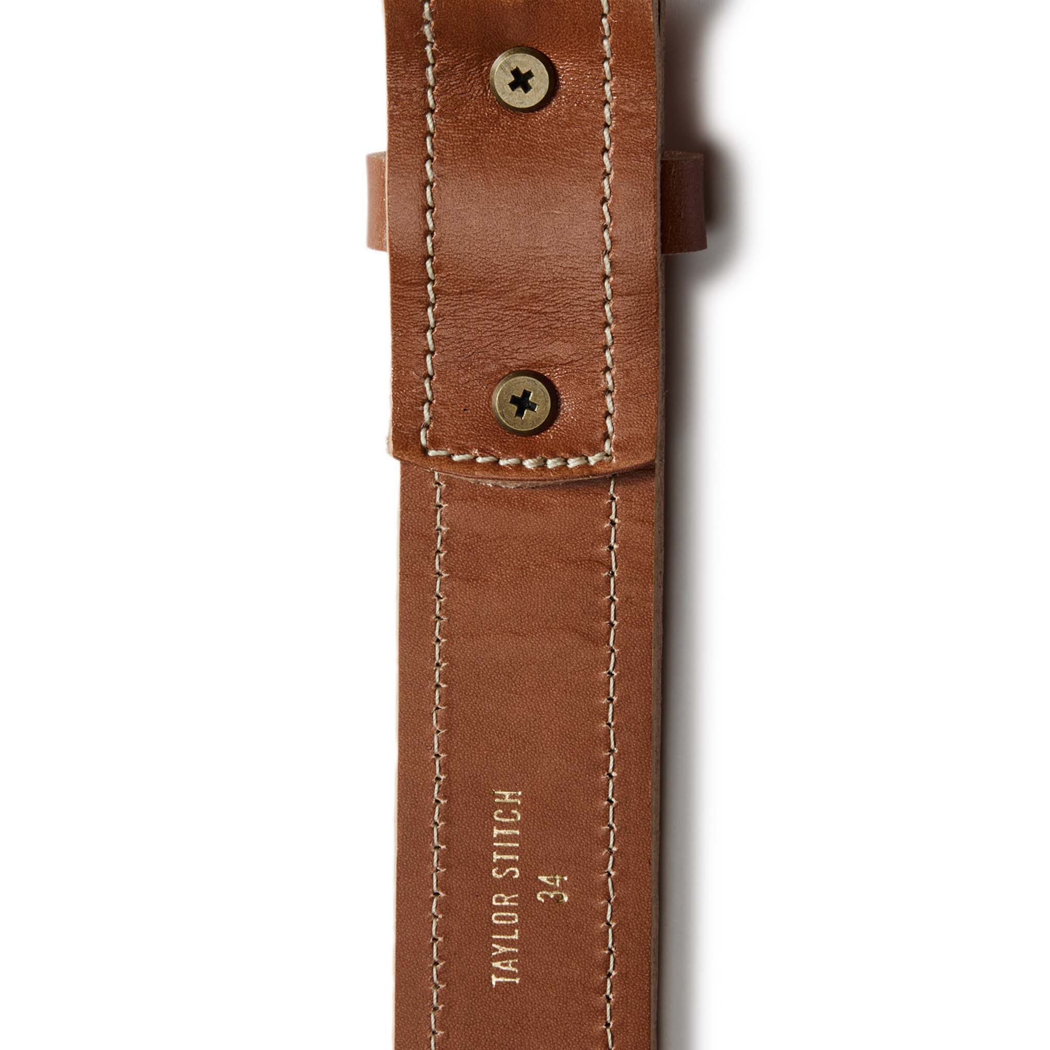 flatlay of the back stitching on The Tooled Belt in Saddle Tan, Accessories by Taylor Stitch
