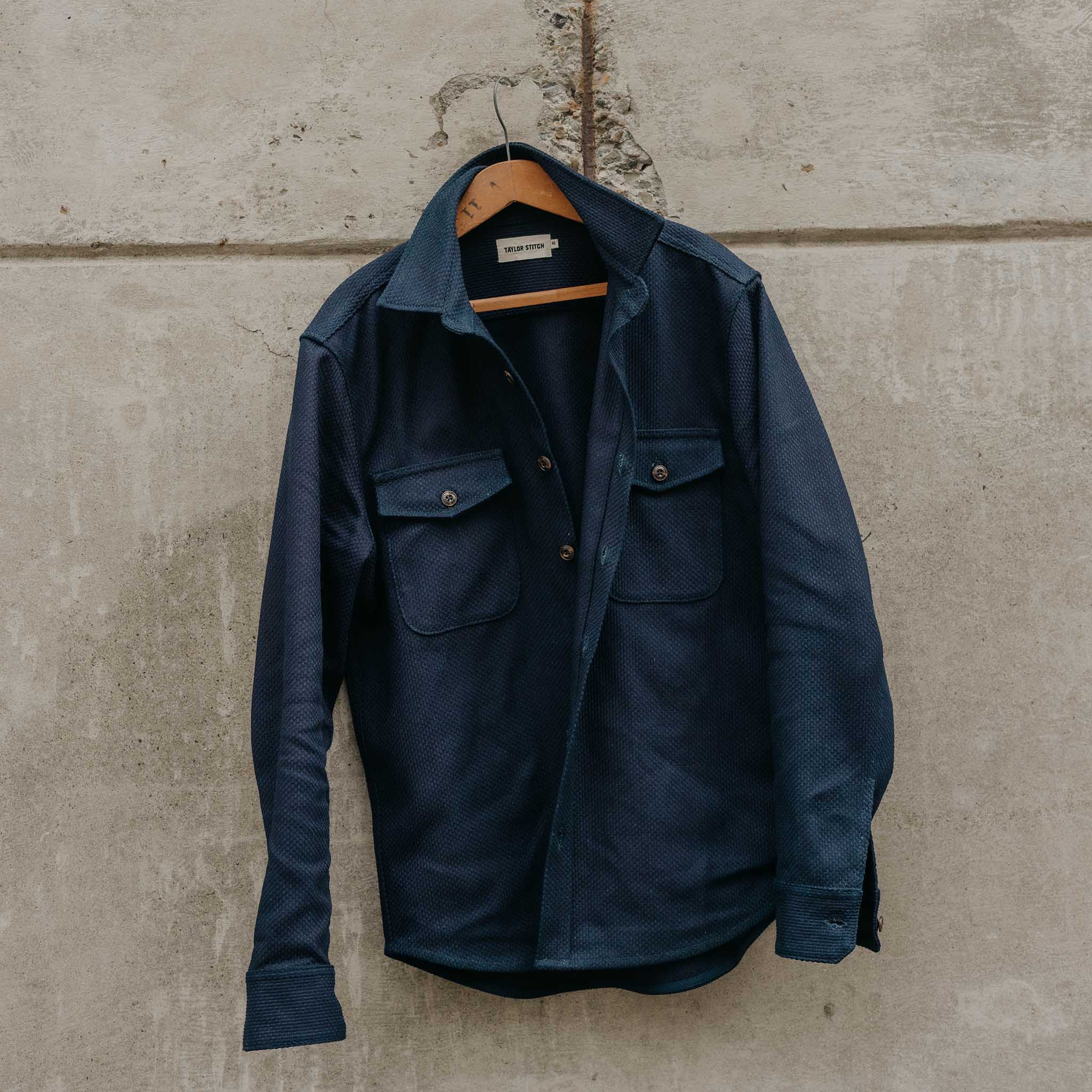 editorial image of The Mill Shirt Jacket in Rigid Indigo Sashiko hanging, Outerwear by Taylor Stitch