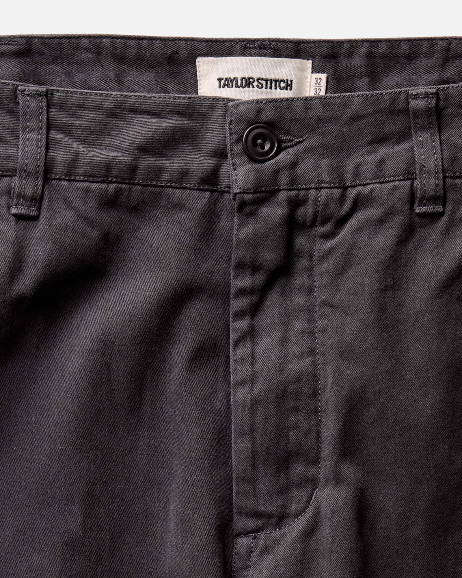 fit model posing in The Democratic Foundation Pant in Organic Faded Black, Bottoms by Taylor Stitch