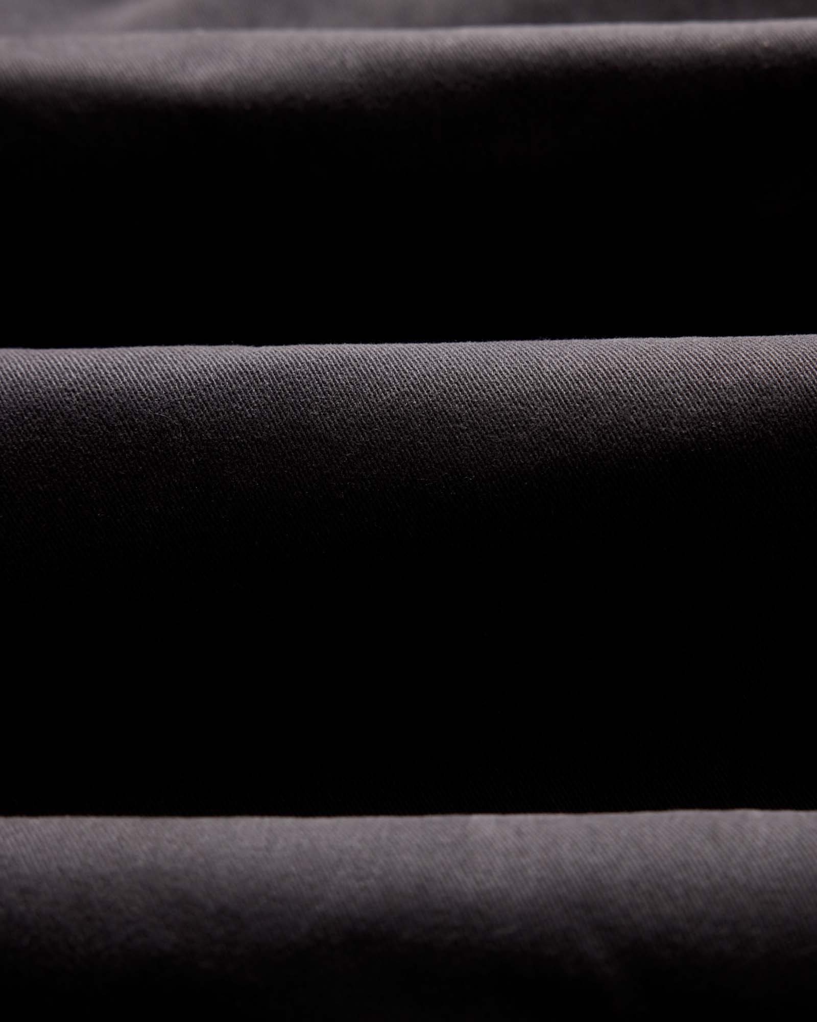 material shot of the twill fabric on The Democratic Foundation Pant in Organic Faded Black, Bottoms by Taylor Stitch