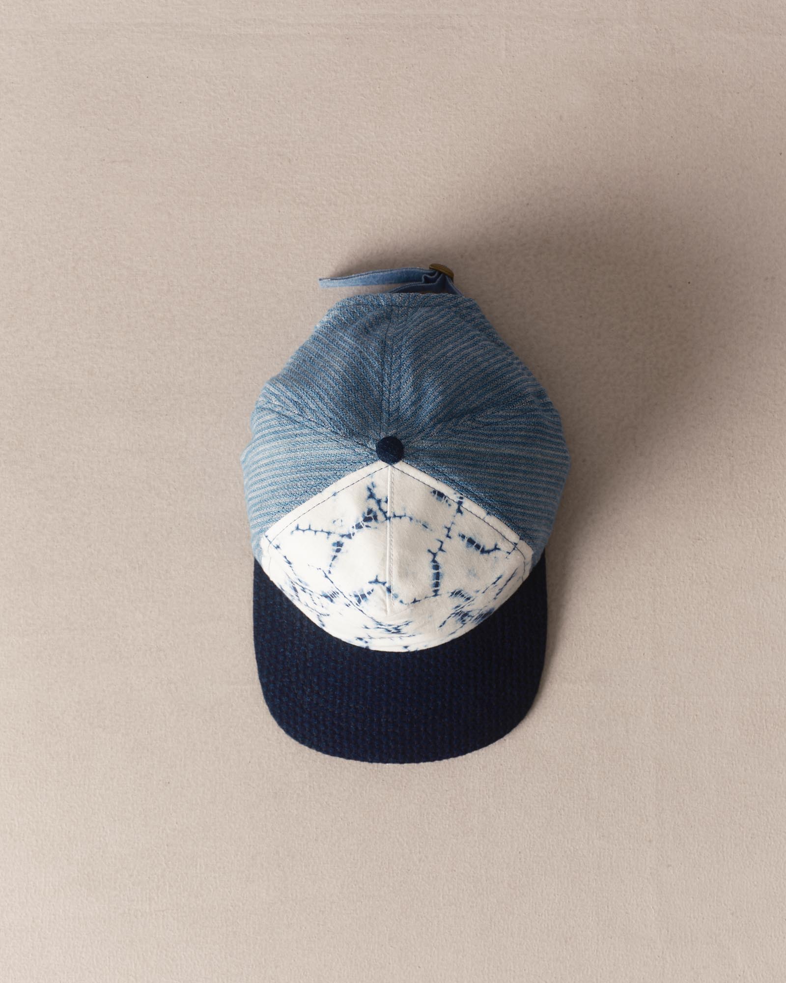 editorial image of The Taylor Stitch x Hypeadelic Cap v2.02 hanging