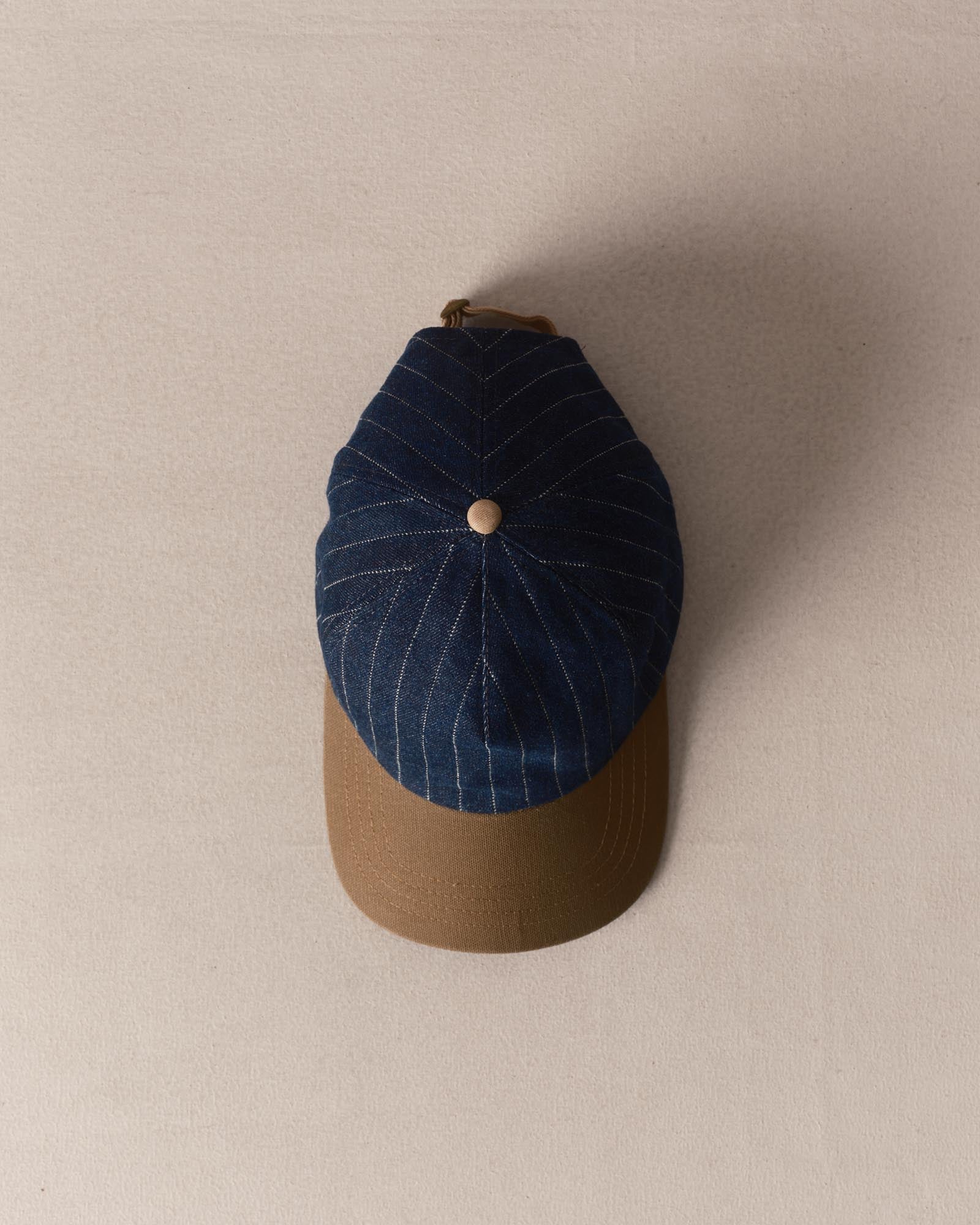 editorial image of The Taylor Stitch x Hypeadelic Cap v2.11 hanging