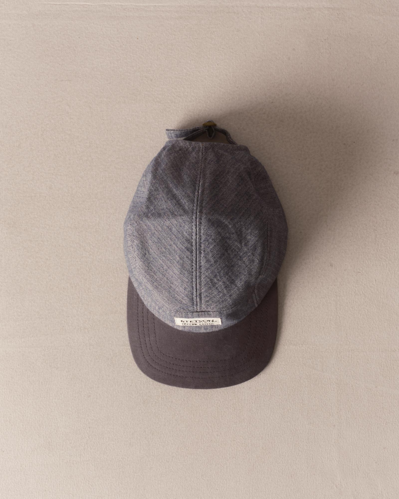 editorial image of The Taylor Stitch x Hypeadelic Cap v2.19 hanging