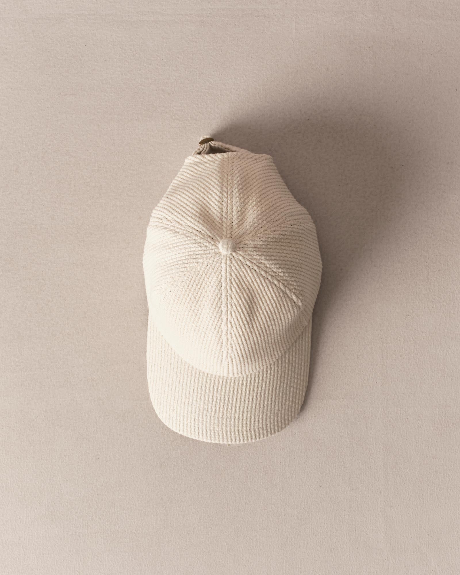 editorial image of The Taylor Stitch x Hypeadelic Cap v2.21 hanging