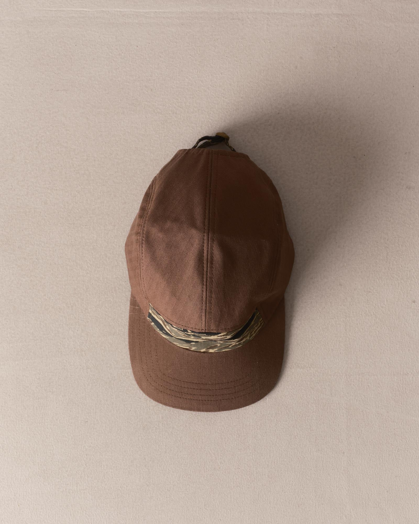 editorial image of The Taylor Stitch x Hypeadelic Cap v2.27 hanging