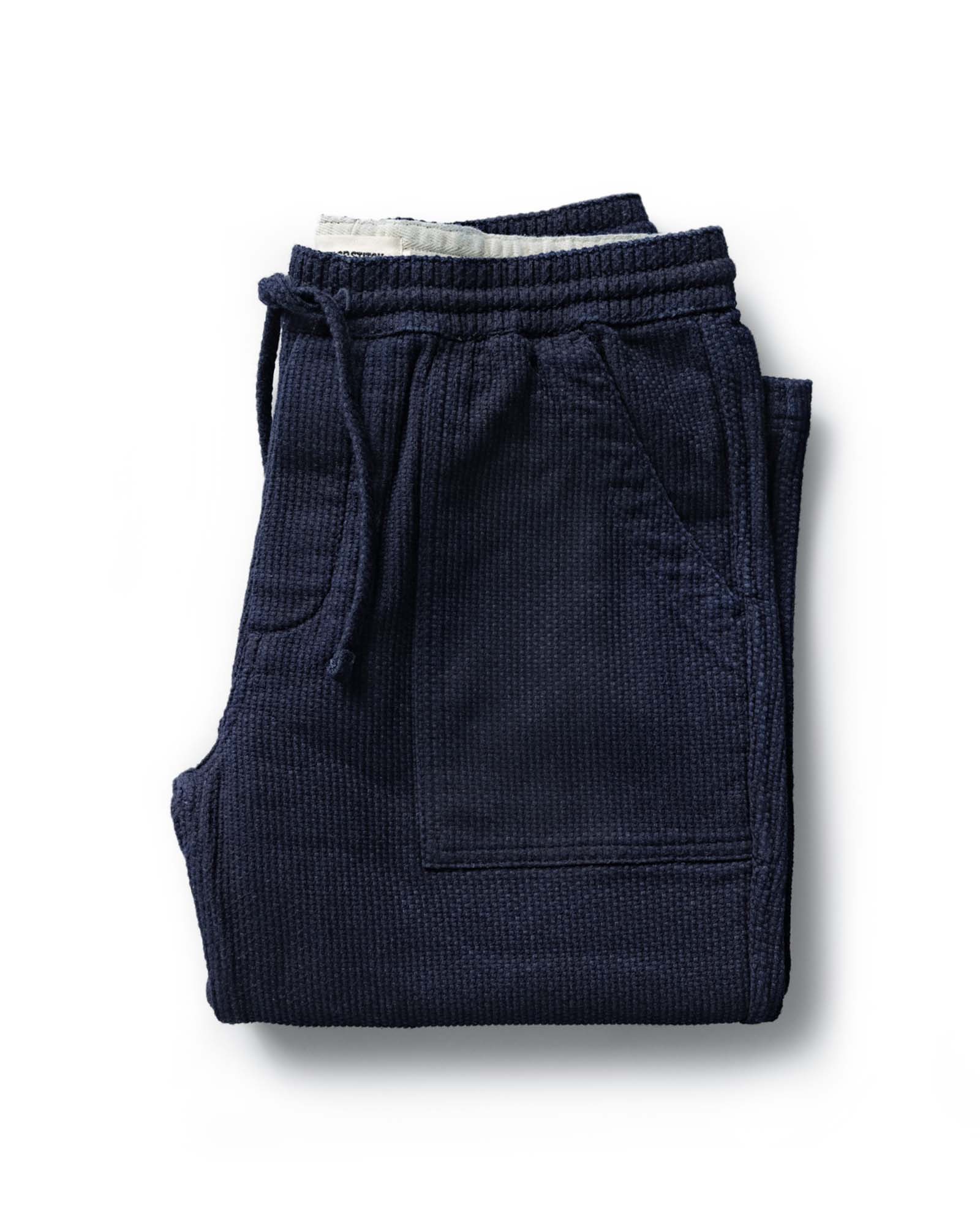 folded flatlay of The Breakwater Pant in Rinsed Indigo Sashiko, Bottoms by Taylor Stitch