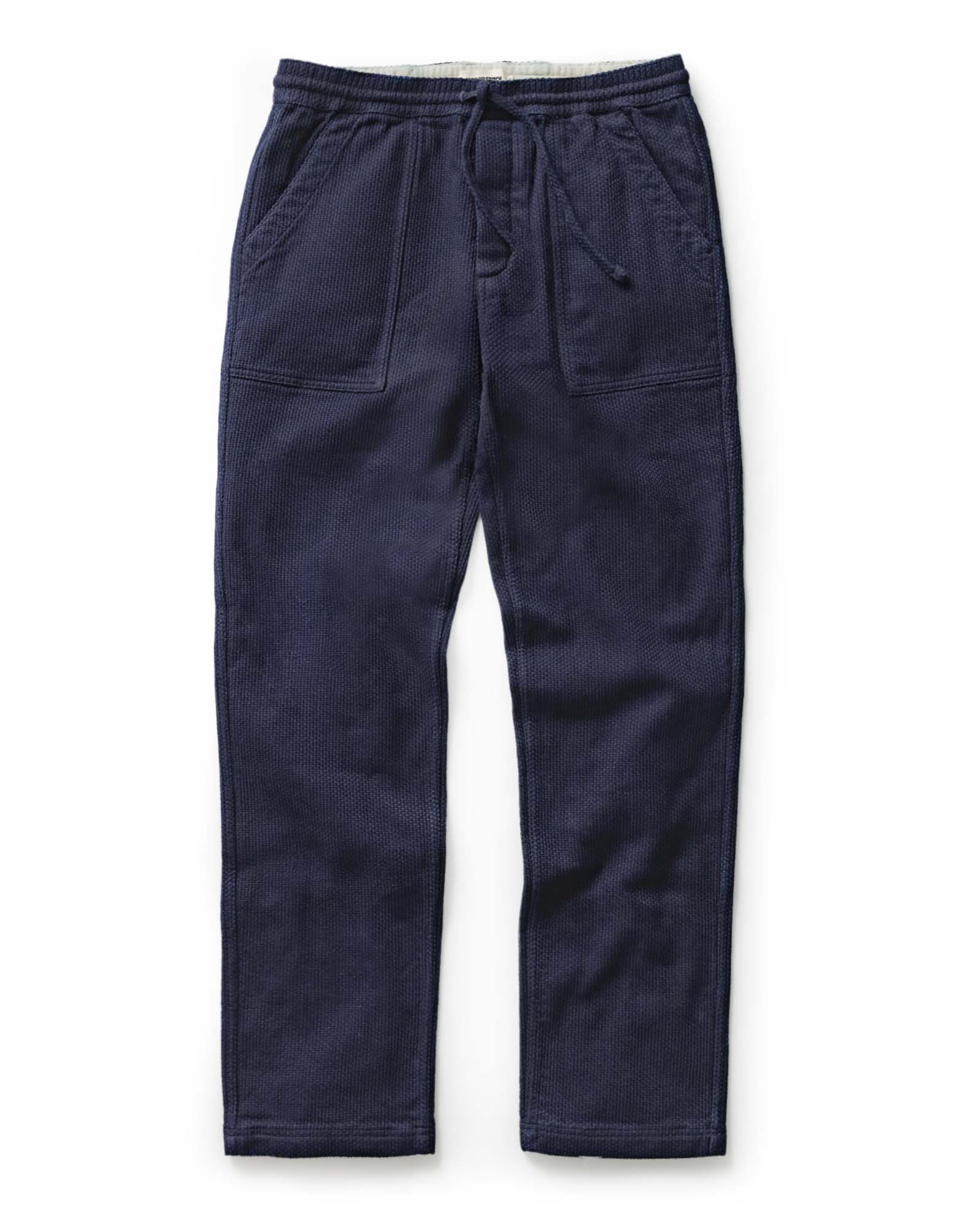 flatlay of The Breakwater Pant in Rinsed Indigo Sashiko, Bottoms by Taylor Stitch