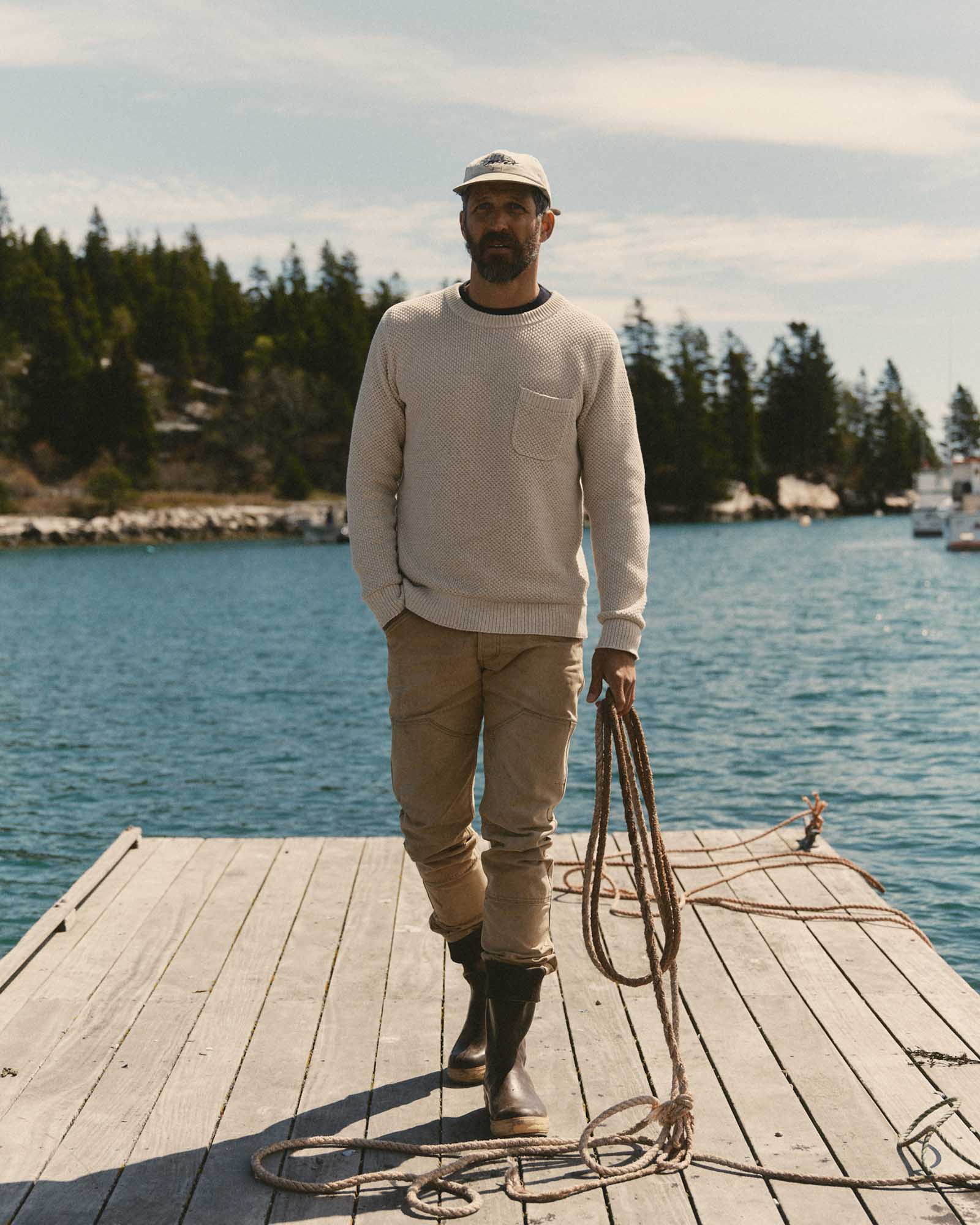 fit model showing off the back of The Crawford Crew Sweater in Marled Natural, Knits by Taylor Stitch
