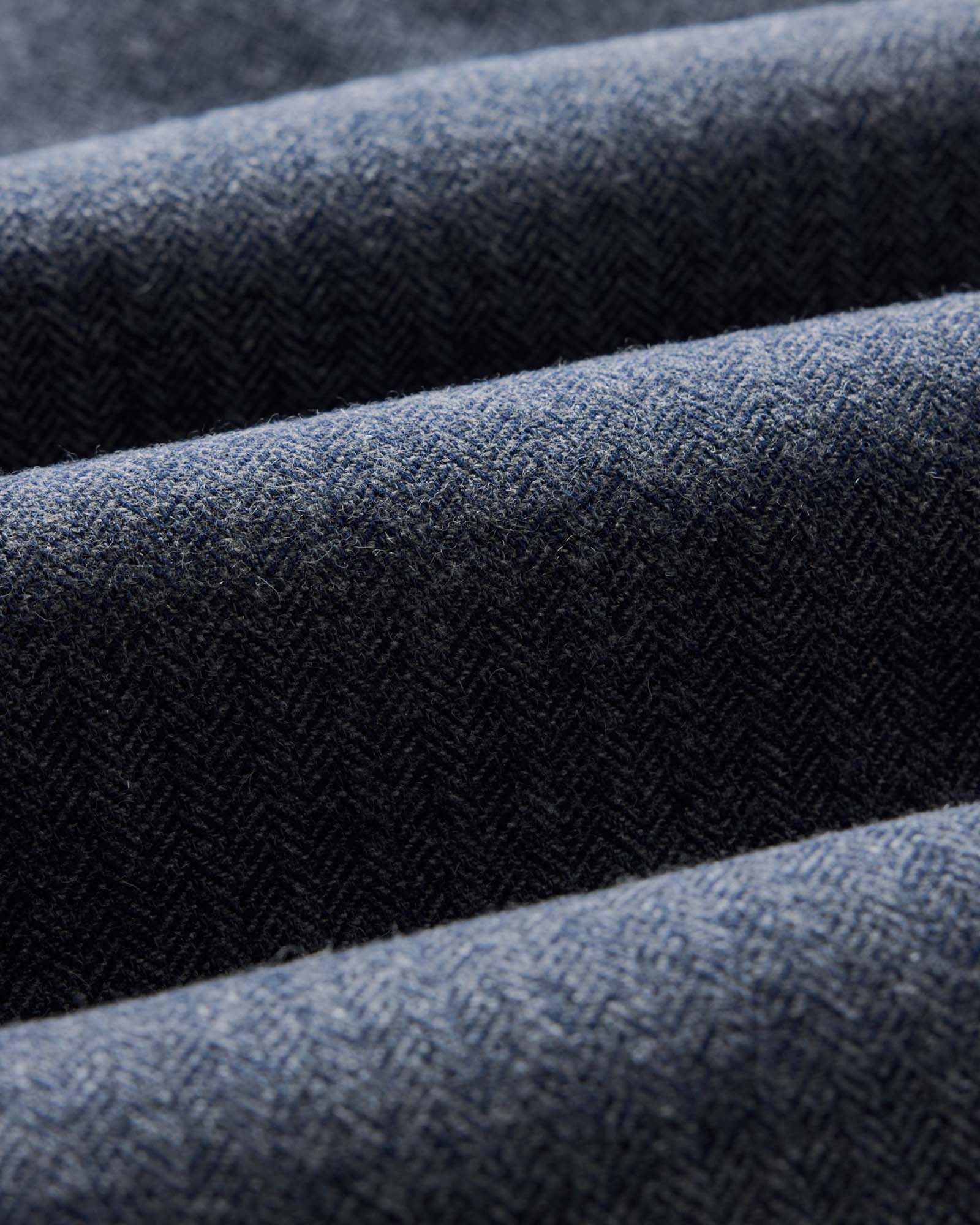 material shot of the fabric on The CPO Overshirt in Indigo Ash Wool Herringbone, Wovens by Taylor Stitch