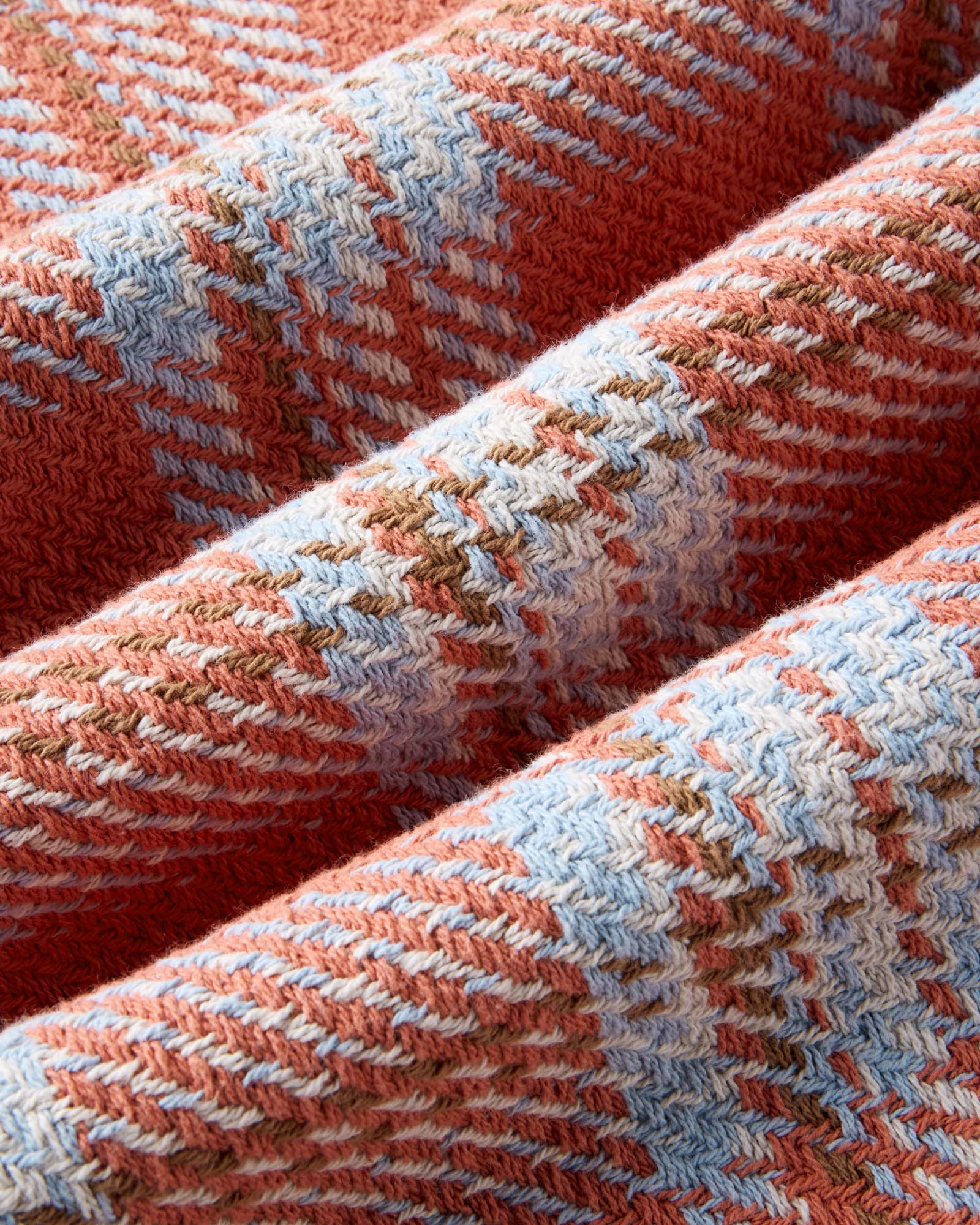 material shot of the fabric on The Cutter Overshirt in Salmon Plaid, Wovens by Taylor Stitch