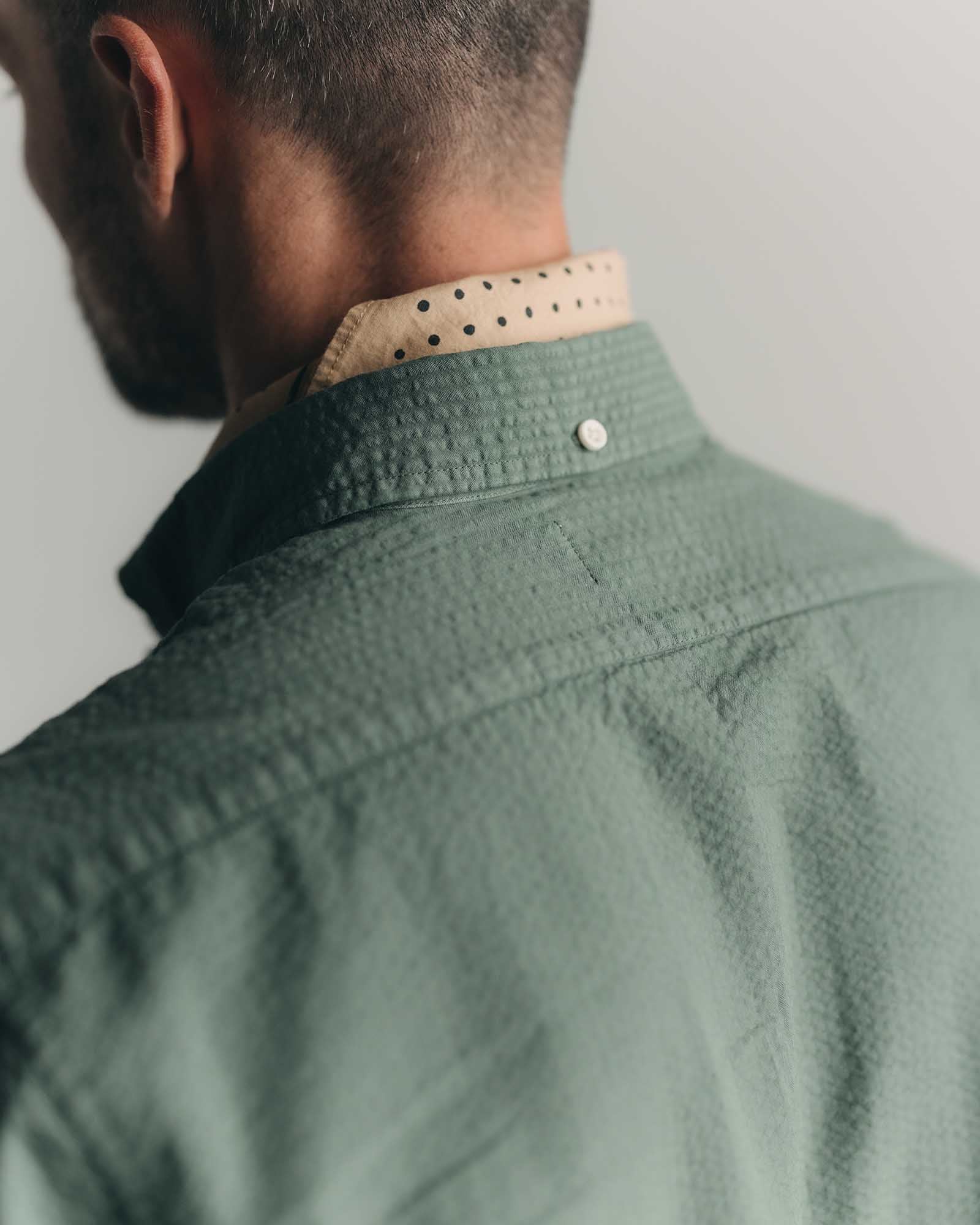 fit model showing off the back of The Jack in Deep Sea Seersucker, Wovens by Taylor Stitch