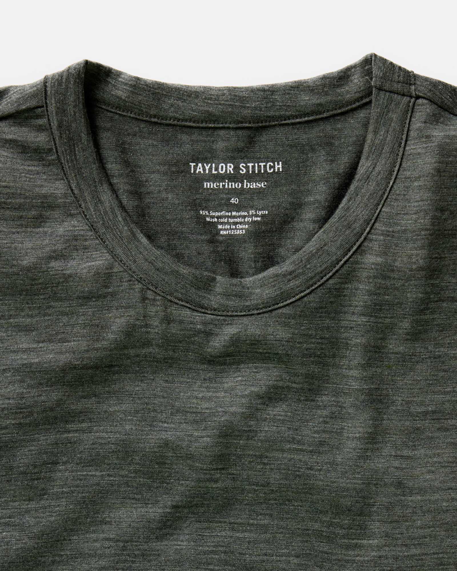 fit model lying on the ground wearing The Merino Tee in Heather Army, Knits by Taylor Stitch