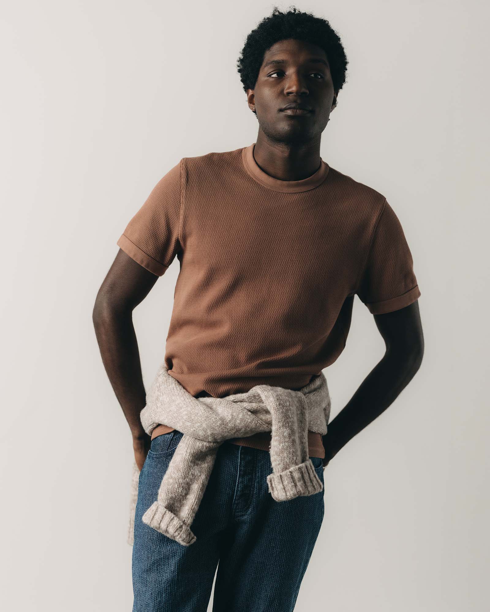 fit model posing in The Organic Cotton Short Sleeve Crew in Faded Brick Waffle, Knits by Taylor Stitch
