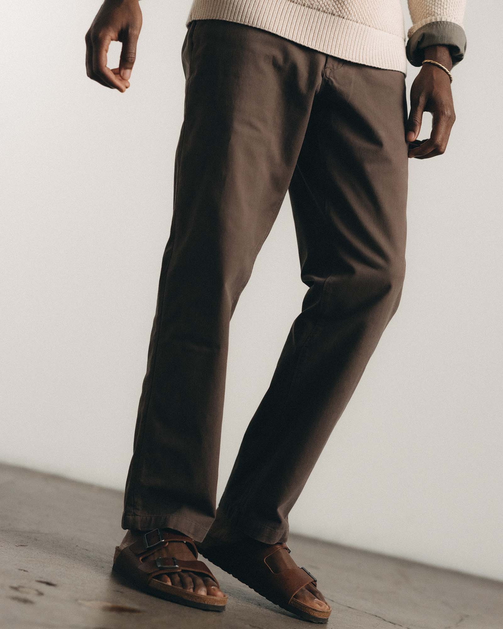 fit model walking wearing The Straight Foundation Pant in Organic Espresso, Bottoms by Taylor Stitch