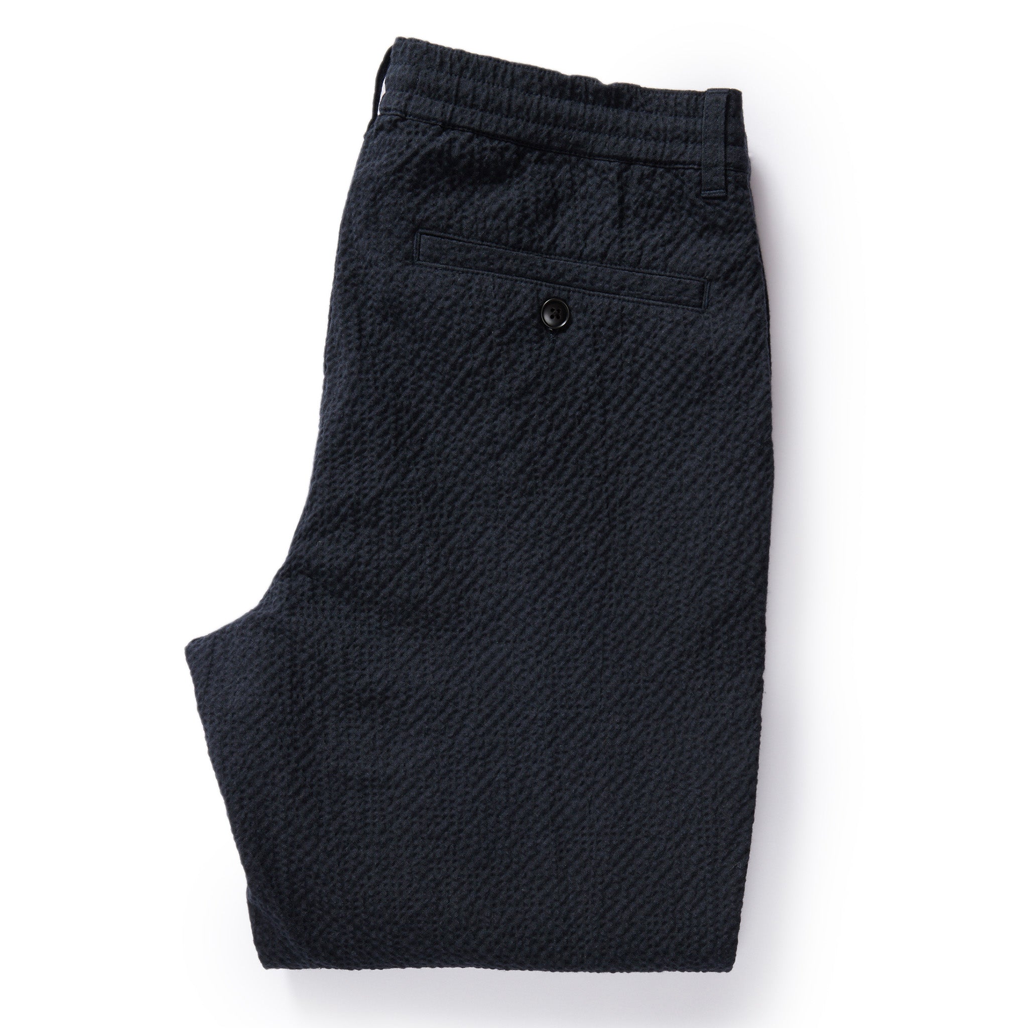 flatlay of The Easy Pant in Heather Navy Seersucker, shown folded from back, Bottoms by Taylor Stitch