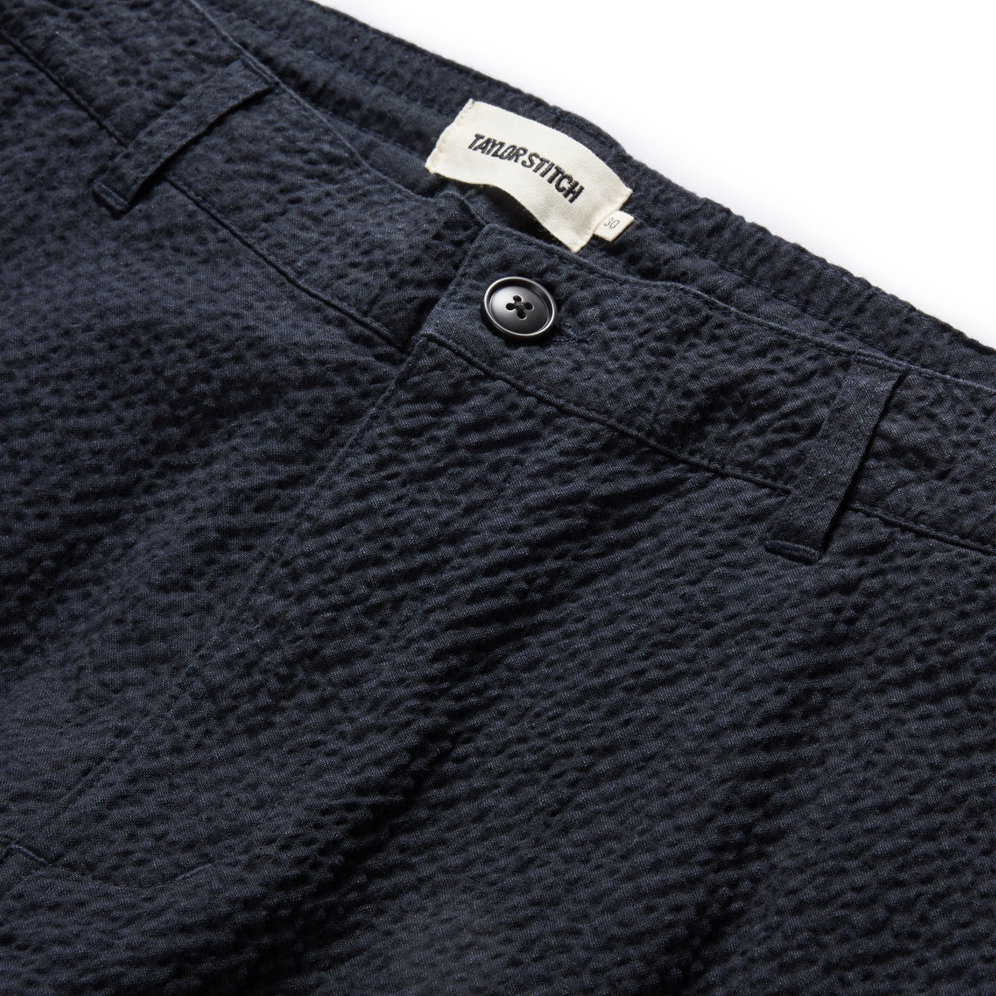 material shot of the button fly on The Easy Pant in Heather Navy Seersucker, Bottoms by Taylor Stitch