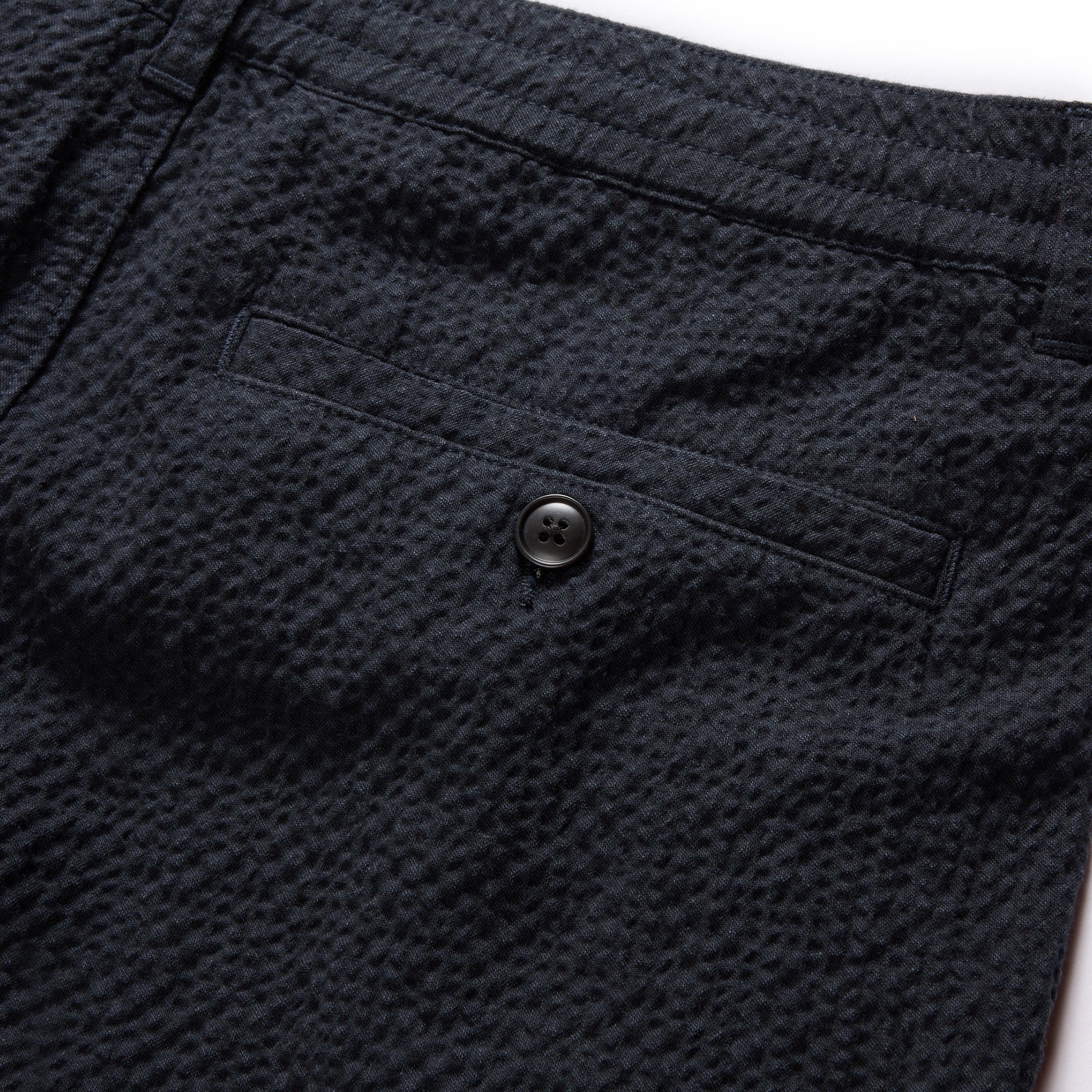 material shot of the rear pocket on The Easy Short in Heather Navy Seersucker, Bottoms by Taylor Stitch