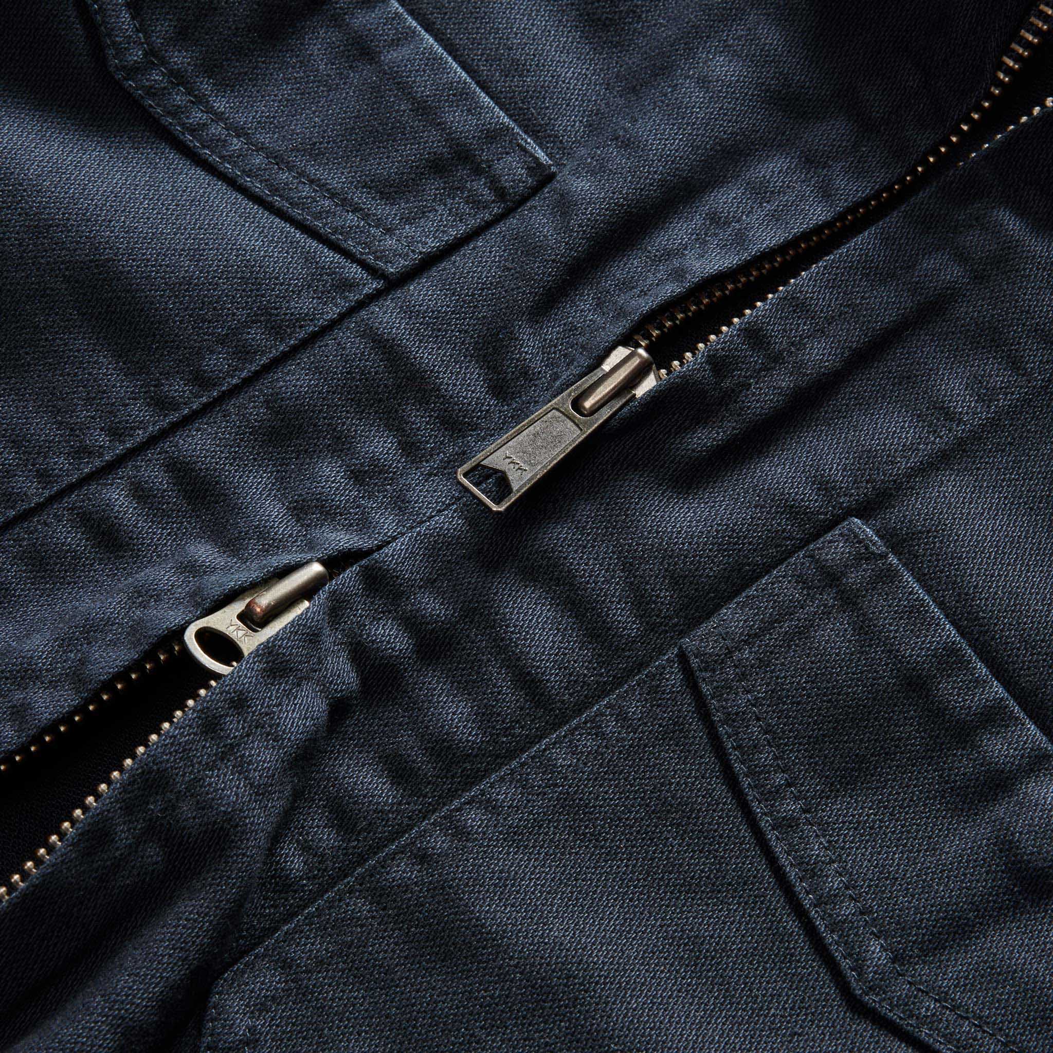material shot of the two-way zipper on The Station Jacket in Dark Navy Broken Twill, Outerwear by Taylor Stitch