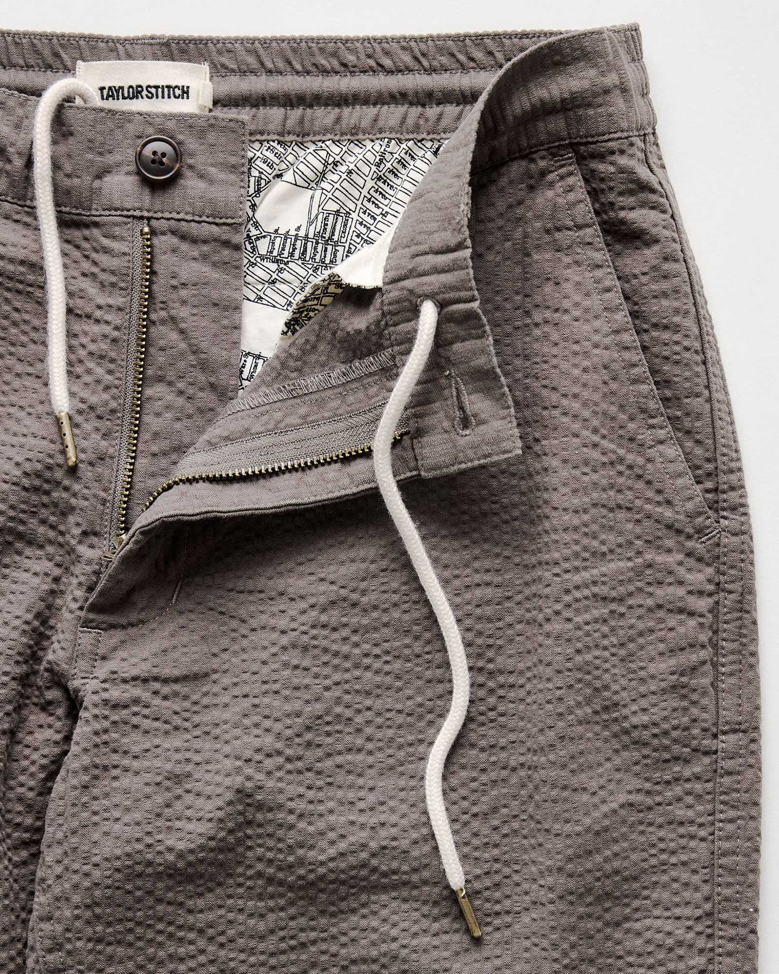 material shot of the zipper on The Easy Pant in Canteen Seersucker, Bottoms by Taylor Stitch