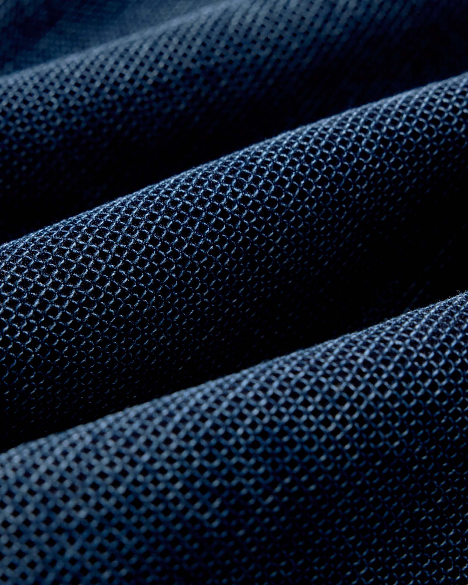 close up of the adjustable back tabs on The Long Haul Jacket in Rinsed Indigo Waffle, Outerwear by Taylor Stitch