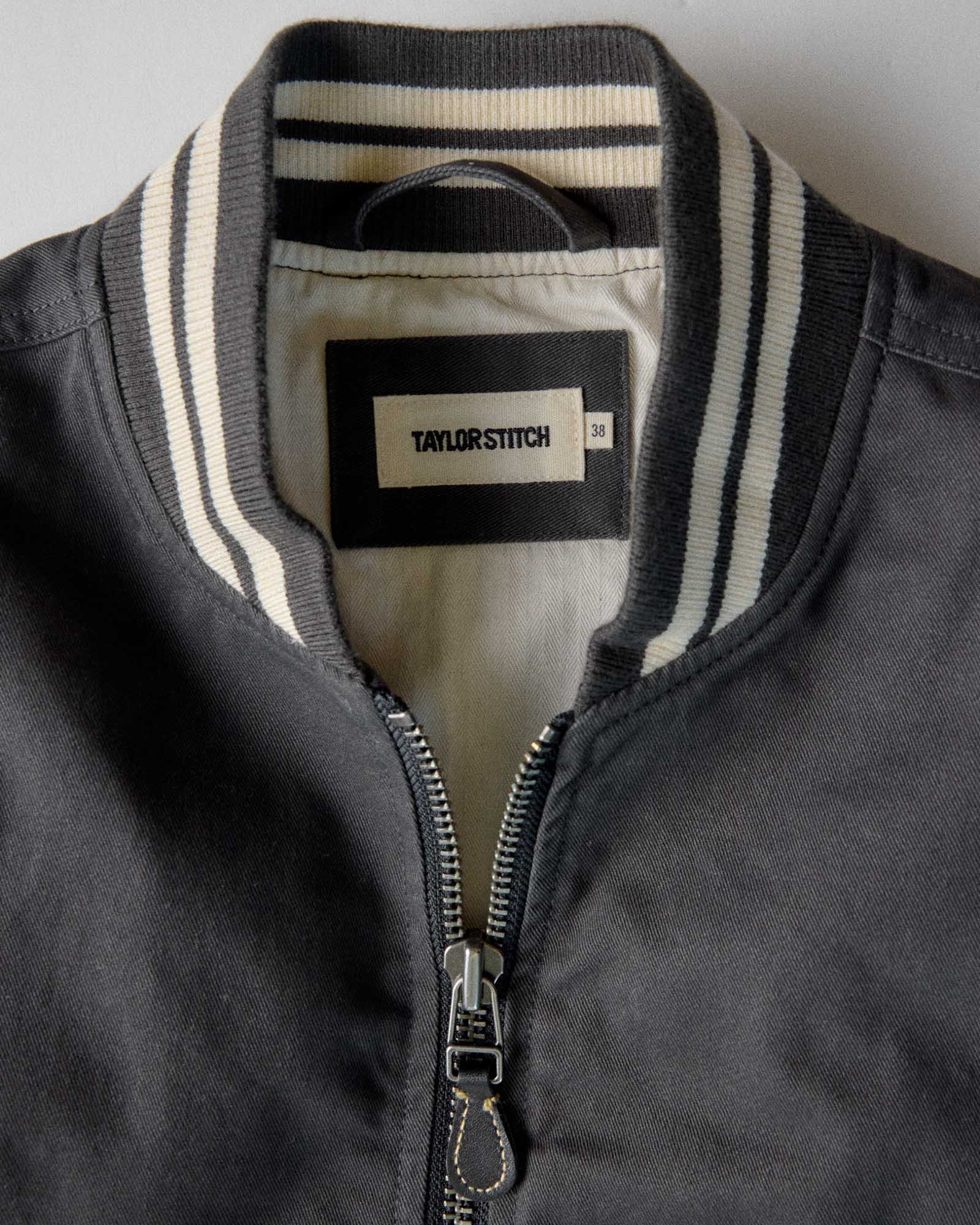 material shot of the collar on The Speedway Bomber in Organic Faded Black Twill, Outerwear by Taylor Stitch