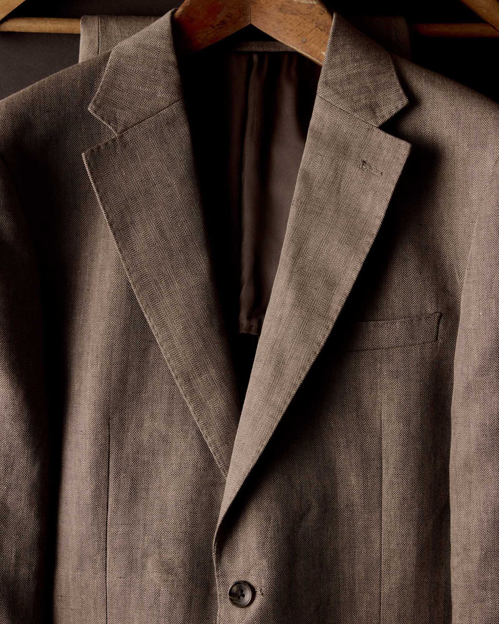 editorial image of The Stevens Sportcoat in Coffee Linen Herringbone hanging, Outerwear by Taylor Stitch