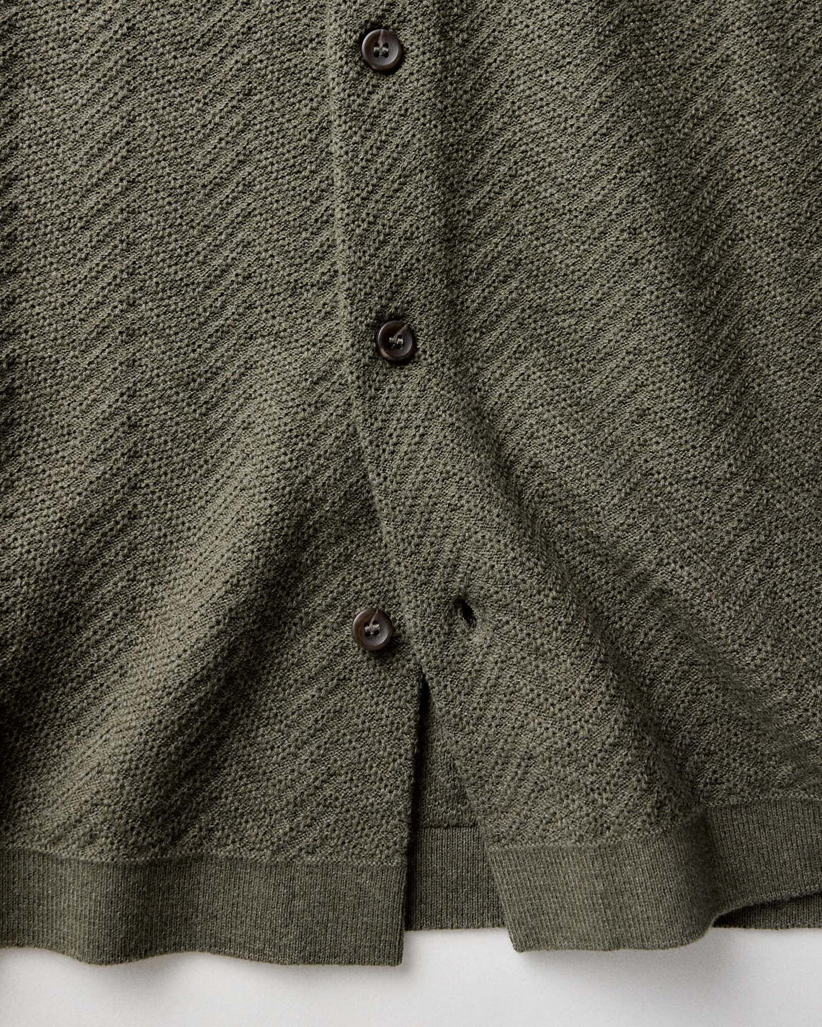 material shot of the buttons on The Button Down Polo in Cilantro Herringbone, Knits by Taylor Stitch