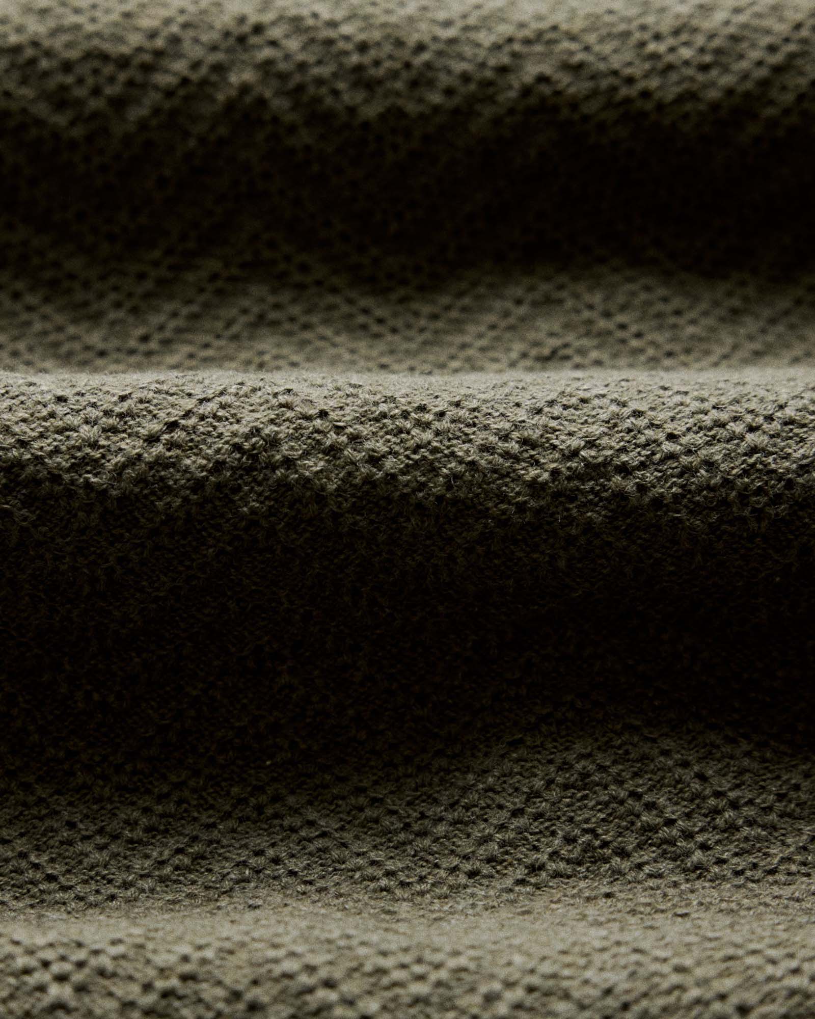 material shot of the fabric texture on The Button Down Polo in Cilantro Herringbone, Knits by Taylor Stitch