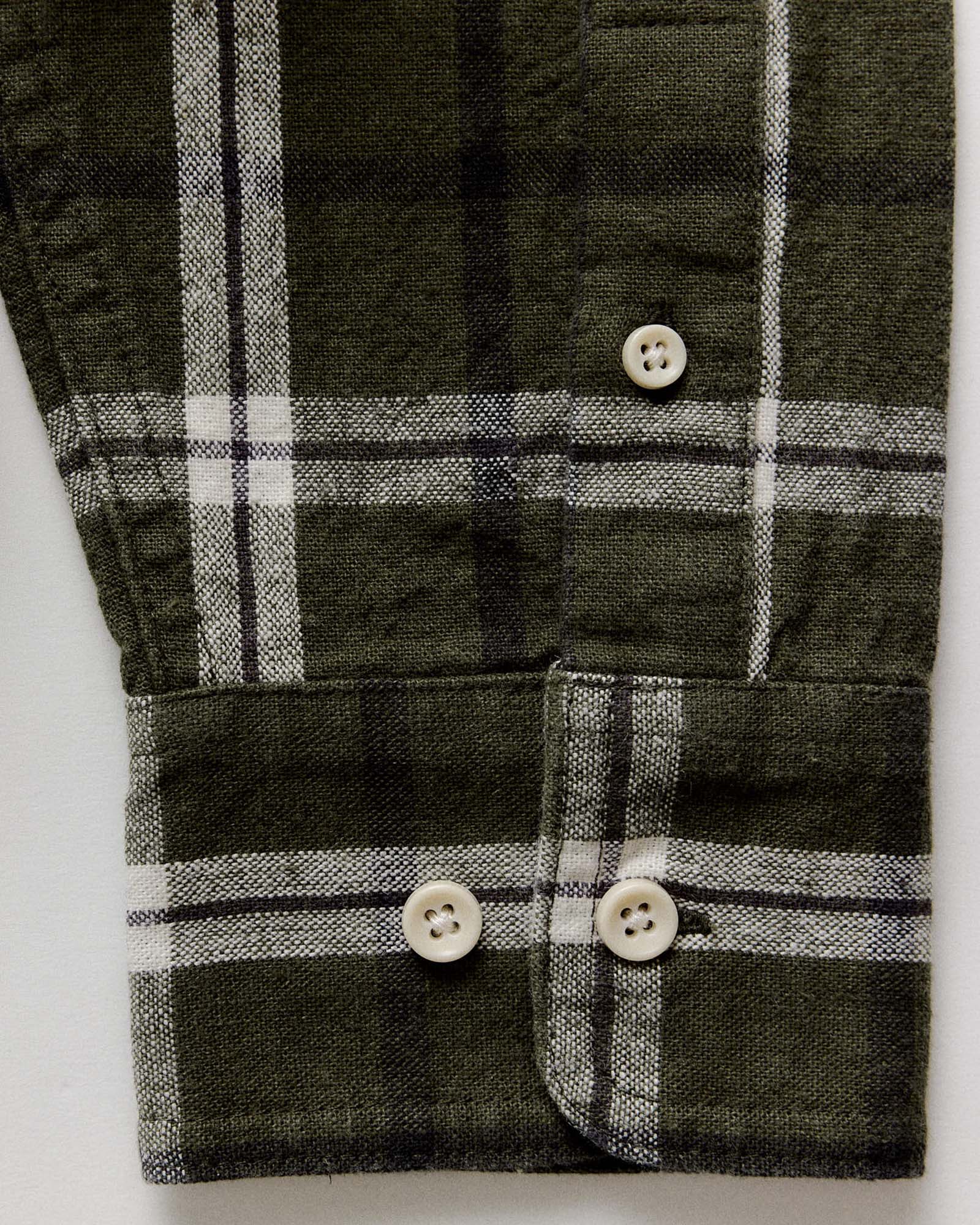 material shot of the cuff on The Craftsman Shirt in Canteen Plaid Linen, Wovens by Taylor Stitch