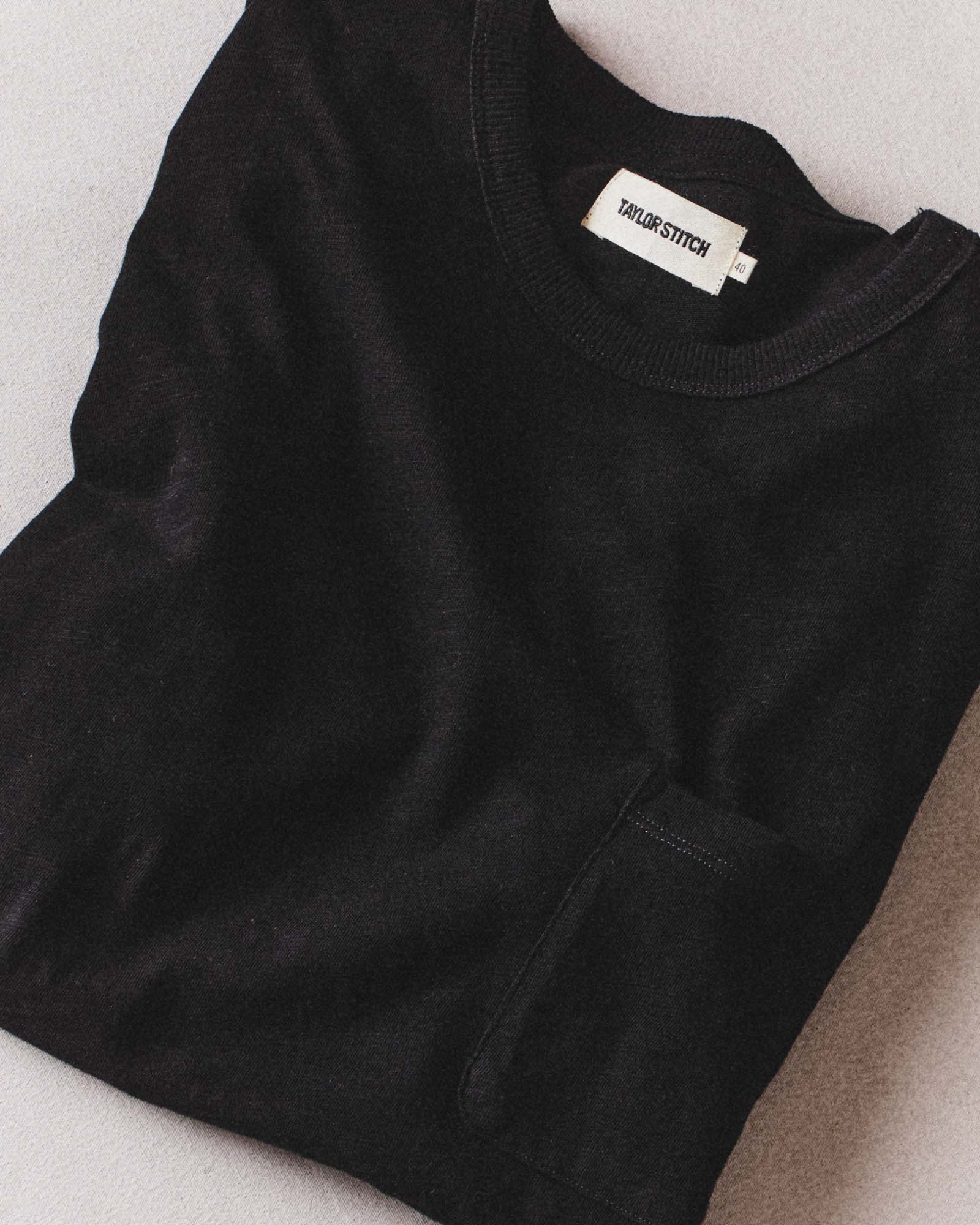 fit model posing in The Organic Cotton Tee in Black Indigo, Knits by Taylor Stitch