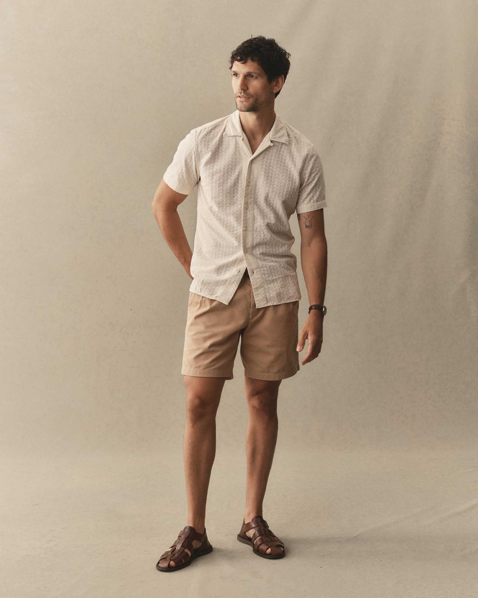 fit model posing in The Davis Shirt in Vintage White Embroidered Stripe, Wovens by Taylor Stitch