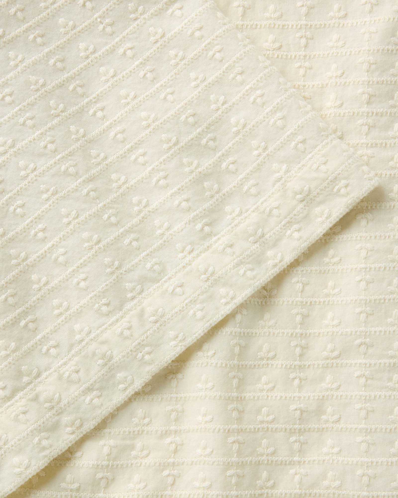 material shot of the sleeve on The Davis Shirt in Vintage White Embroidered Stripe, Wovens by Taylor Stitch