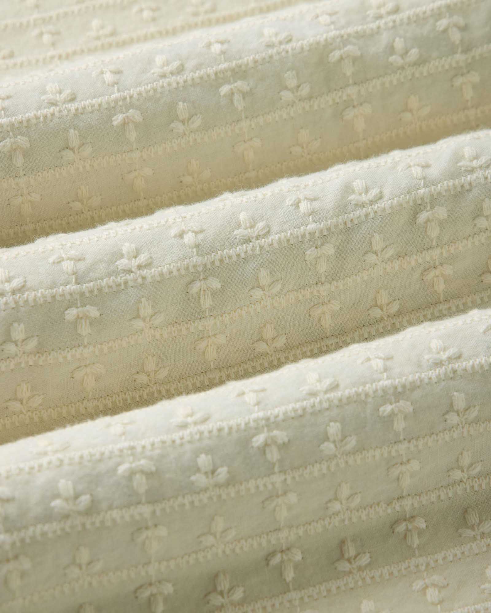 material shot of the fabric on The Davis Shirt in Vintage White Embroidered Stripe, Wovens by Taylor Stitch