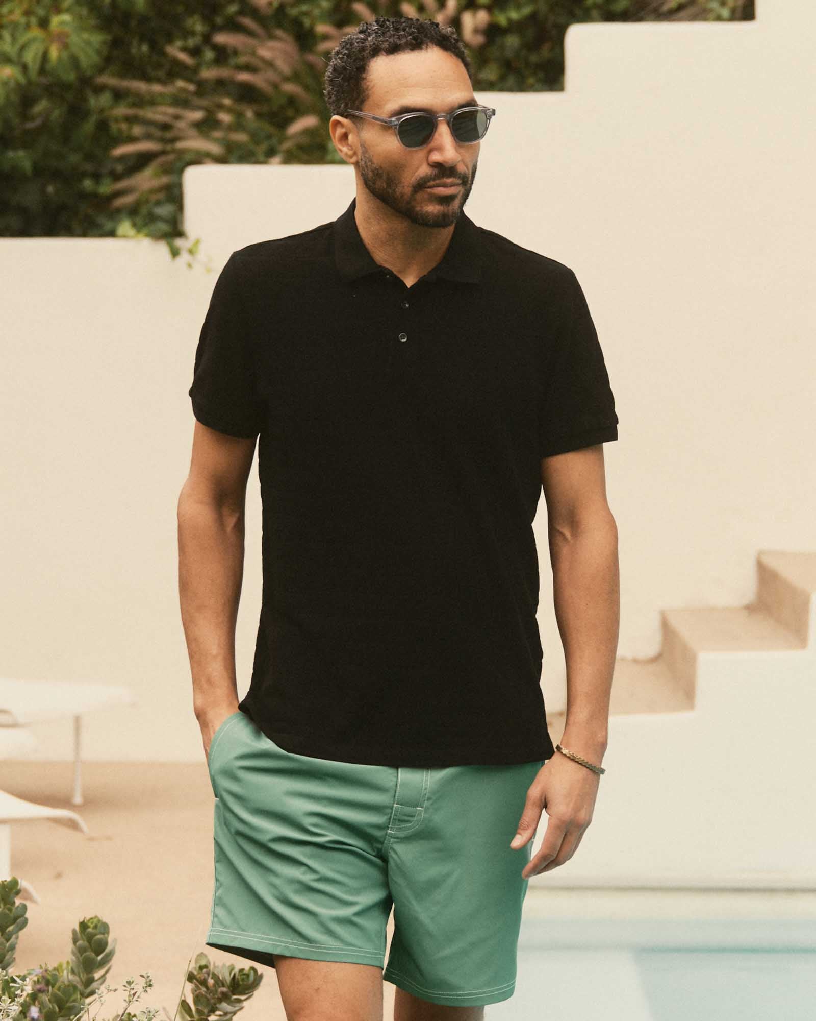 fit model showing off The Pacific Polo in Black Indigo Pique Stripe, Knits by Taylor Stitch