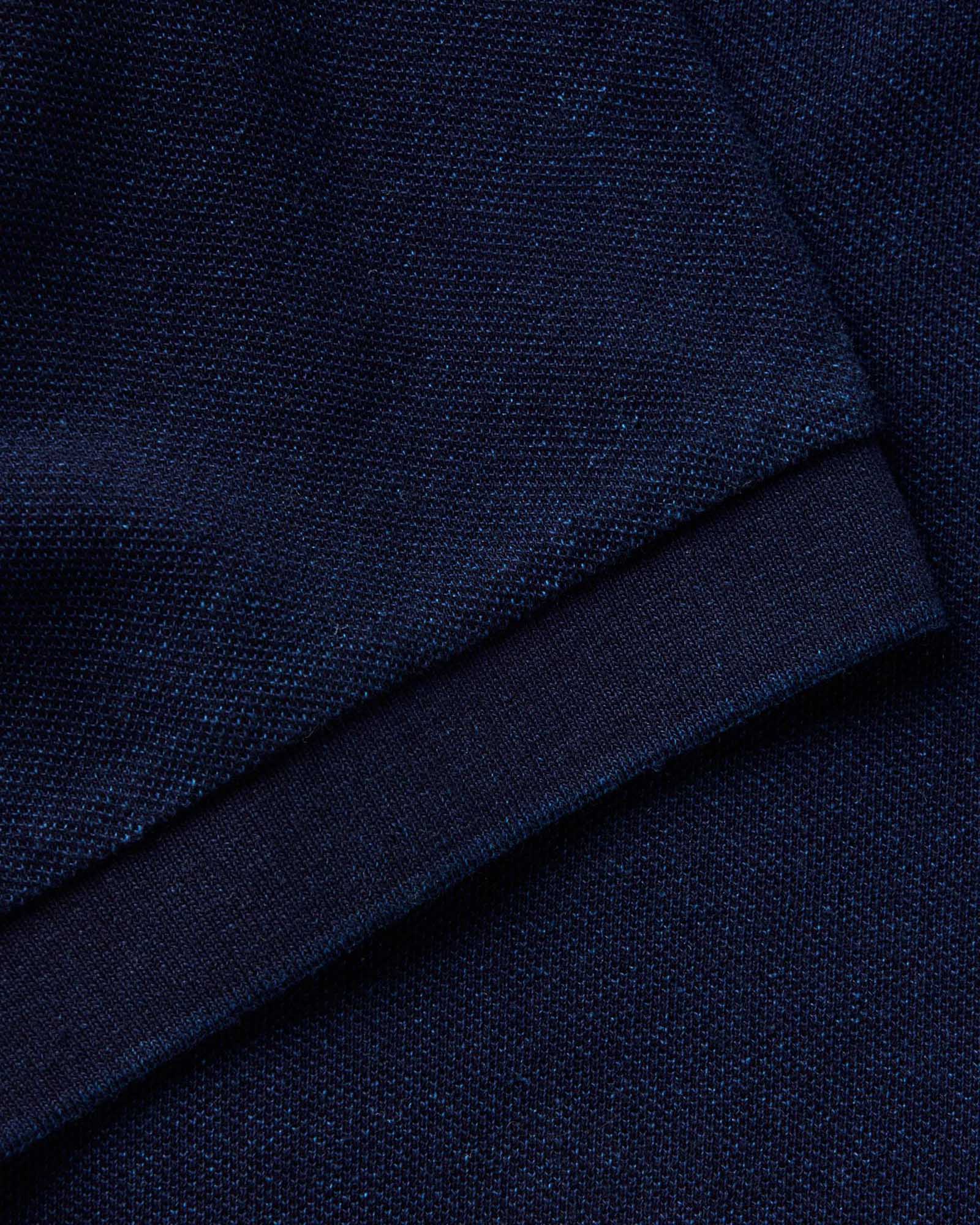 material shot of the sleeve on The Pacific Polo in Rinsed Indigo Pique, Knits by Taylor Stitch