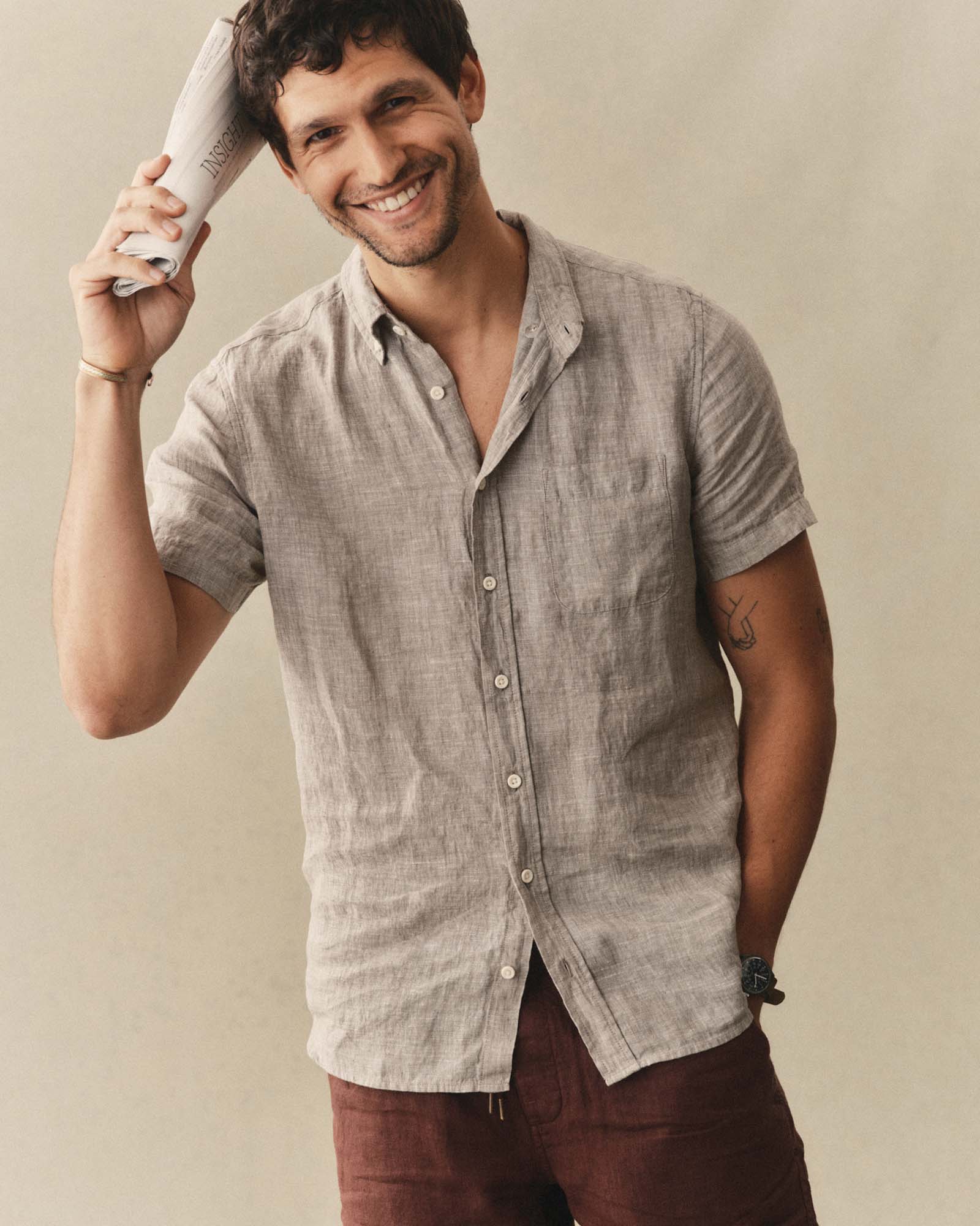 fit model posing in The Short Sleeve Jack in Sage Linen, Wovens by Taylor Stitch