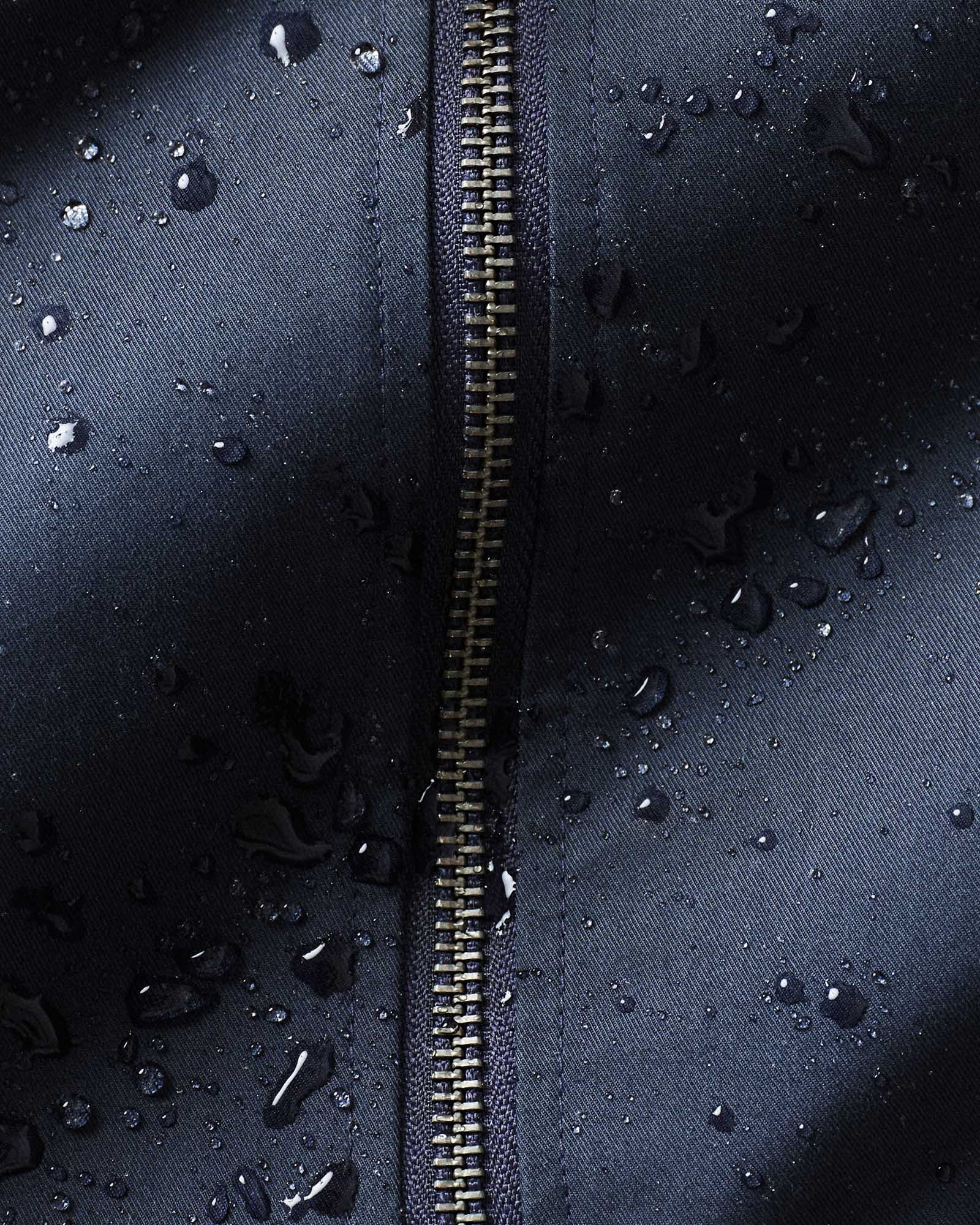 material shot of the laces on The Squall Anorak in Navy Twill, Outerwear by Taylor Stitch