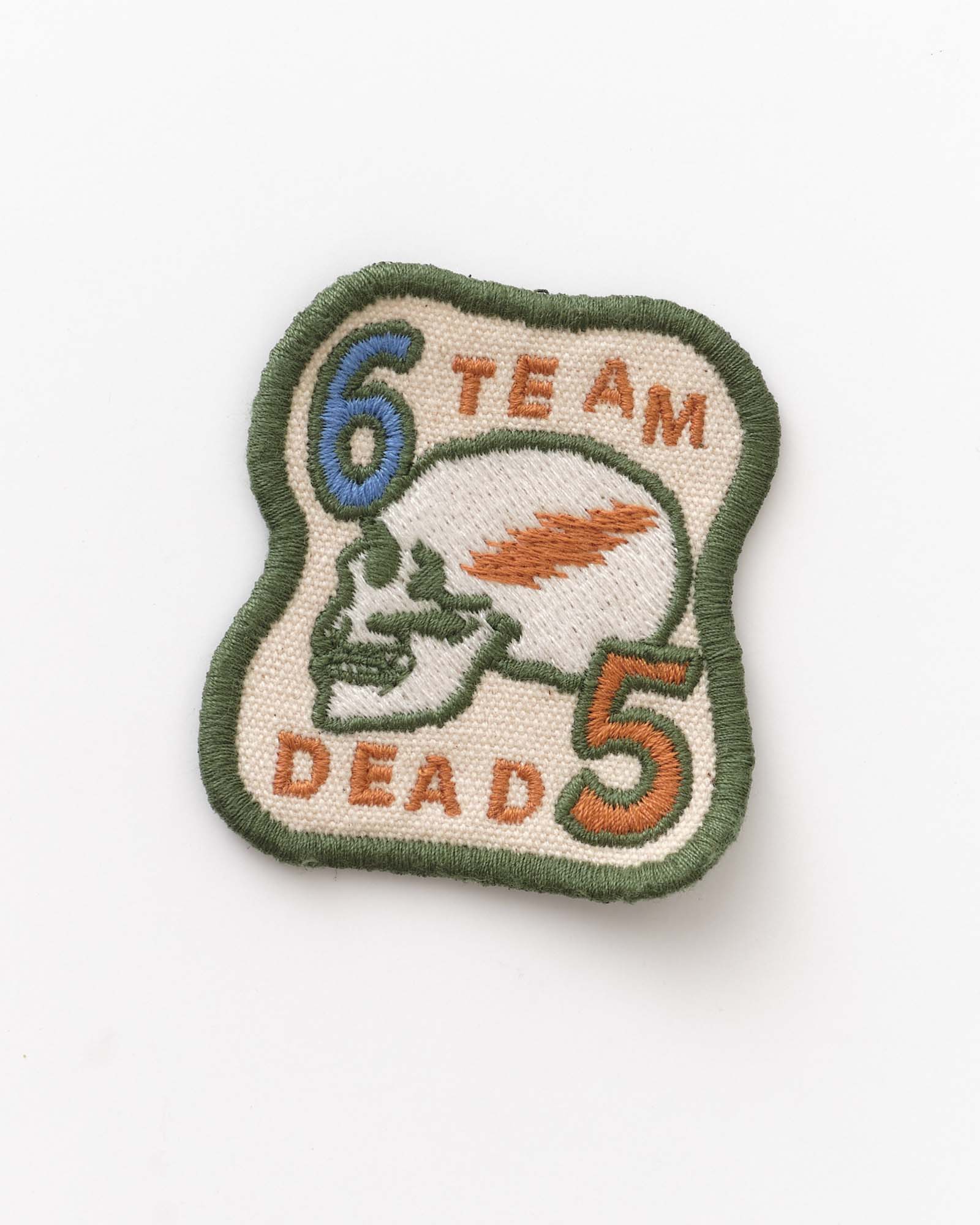 Patch with '6 Team Dead 5' text and design on a white background, Accessories by Taylor Stitch