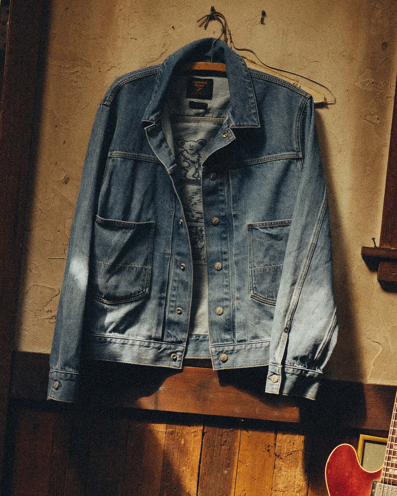 editorial image of The Haight Jacket in Light Wash Hemp Denim hanging, Outerwear by Taylor Stitch