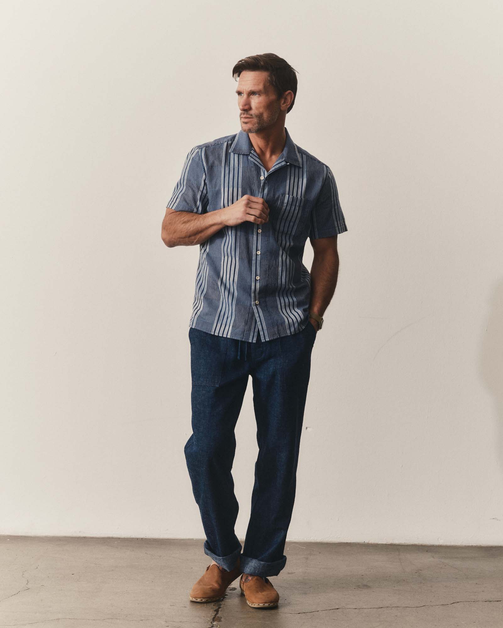fit model posing in The Hawthorne Shirt in Indigo Patchwork, Wovens by Taylor Stitch