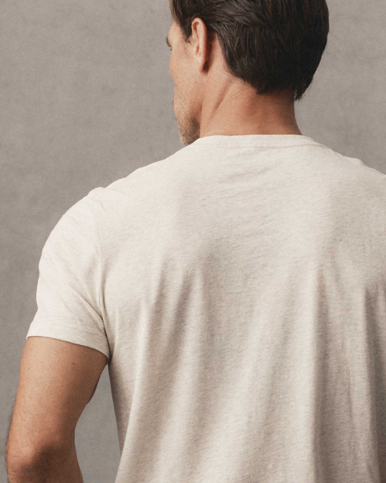 editorial image of The Cotton Hemp Tee in Heather Oat on a stool, Knits by Taylor Stitch