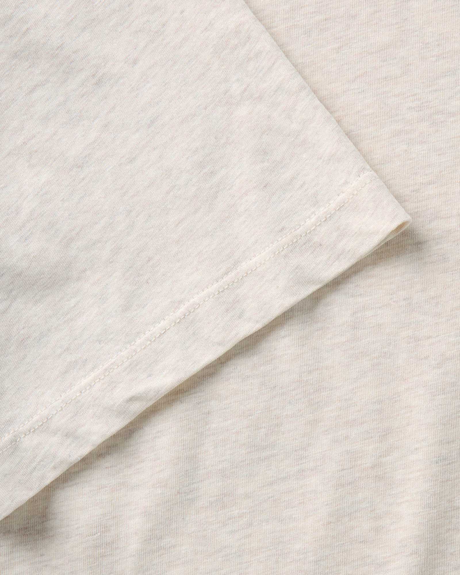 material shot of the sleeve on The Cotton Hemp Tee in Heather Oat, Knits by Taylor Stitch