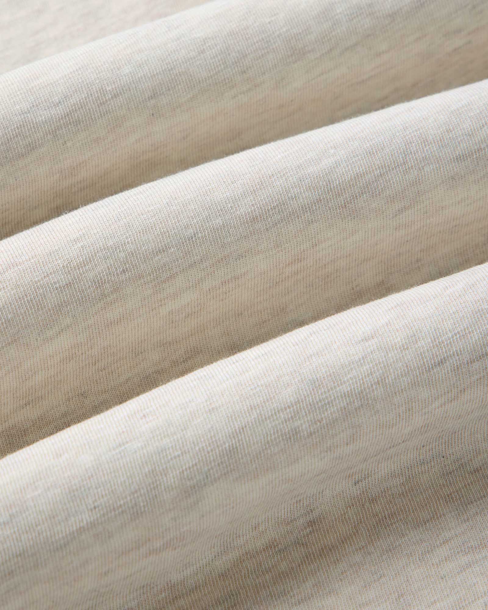 material shot of the fabric on The Cotton Hemp Tee in Heather Oat, Knits by Taylor Stitch
