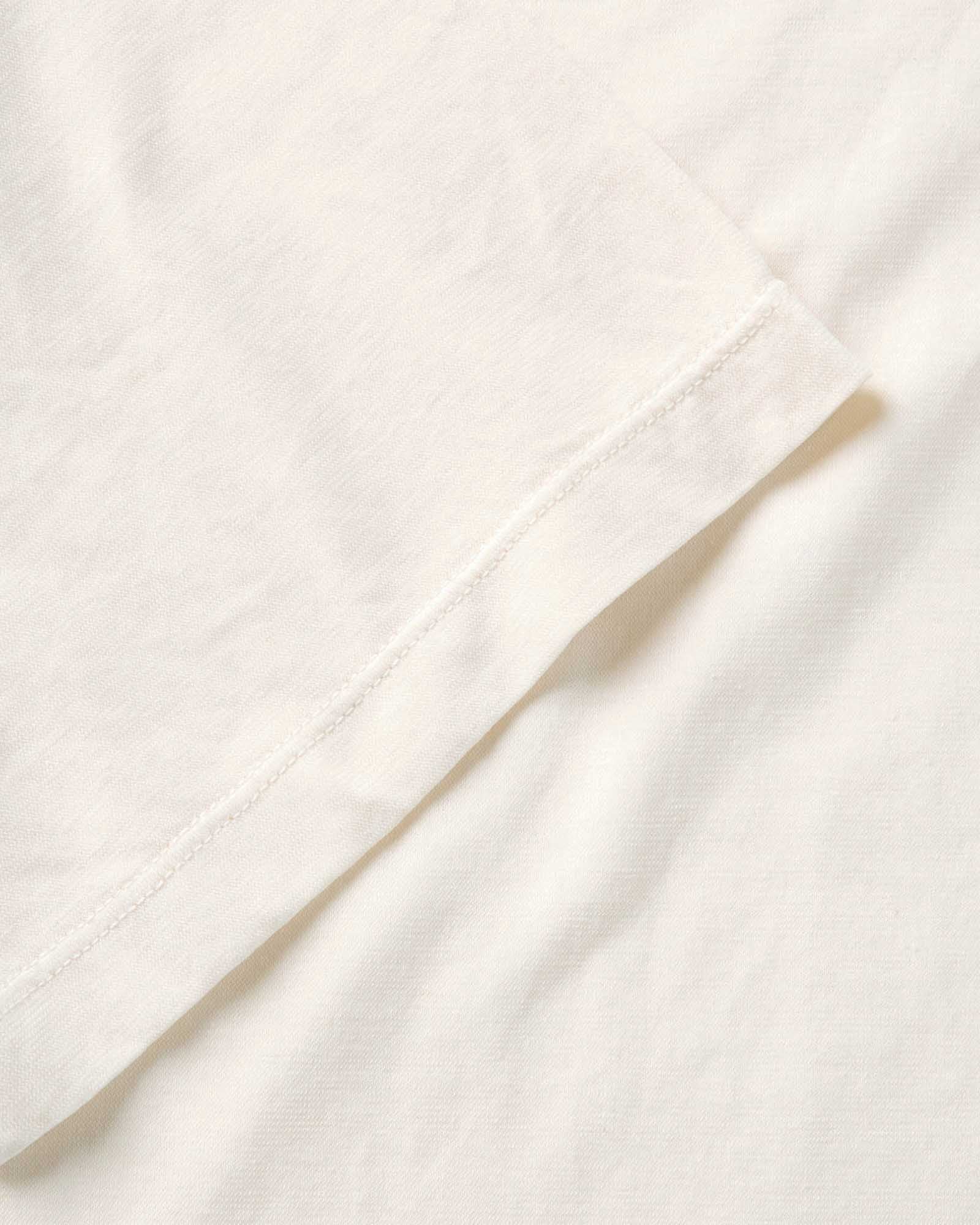 material shot of the sleeve on The Cotton Hemp Tee in Vintage White, Knits by Taylor Stitch