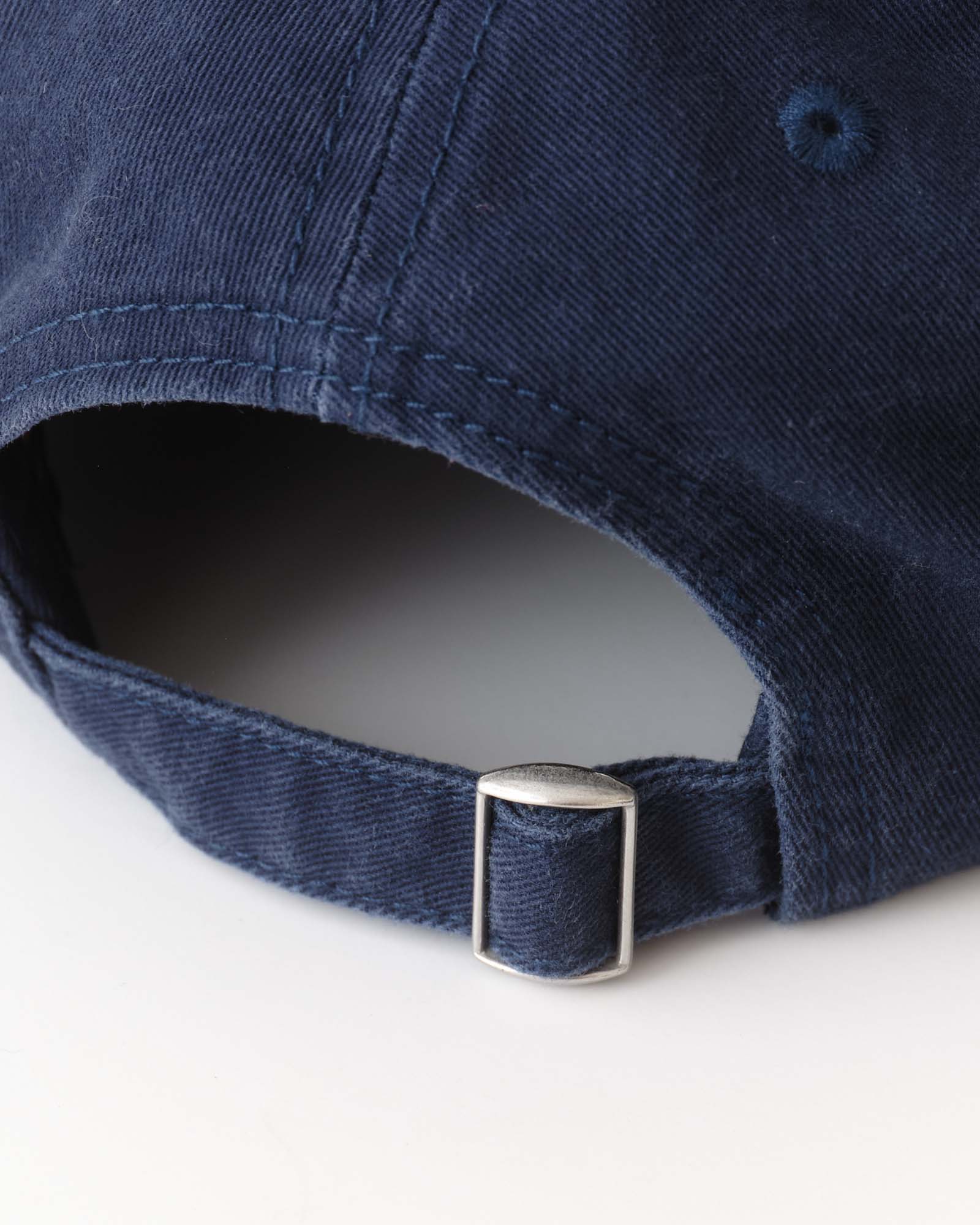 material shot of the back strap on The Mercer Cap in Delta Blue Twill, Accessories by Taylor Stitch
