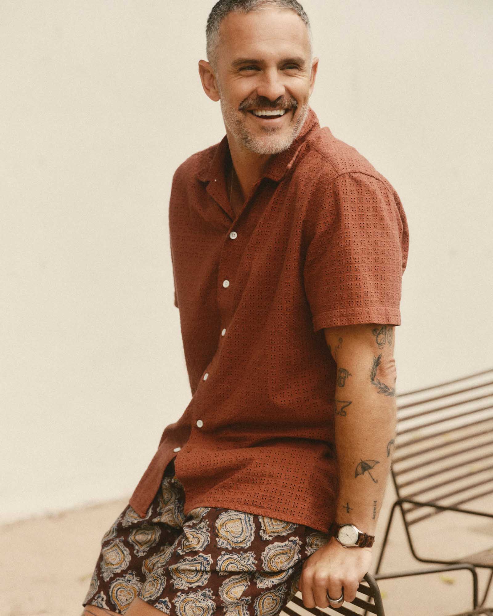 fit model sitting wearing The Davis Shirt in Driftwood Eyelet, Wovens by Taylor Stitch